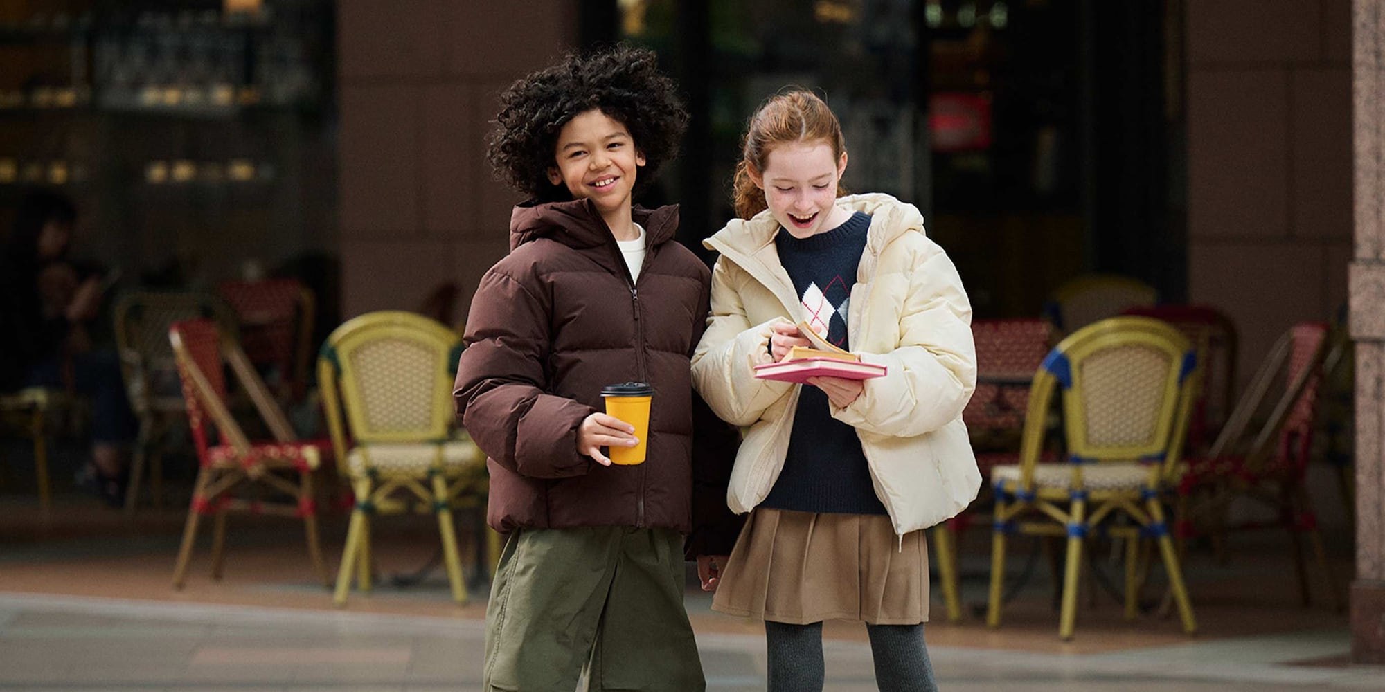 two models wearing Volume Down Parka down brown and off white