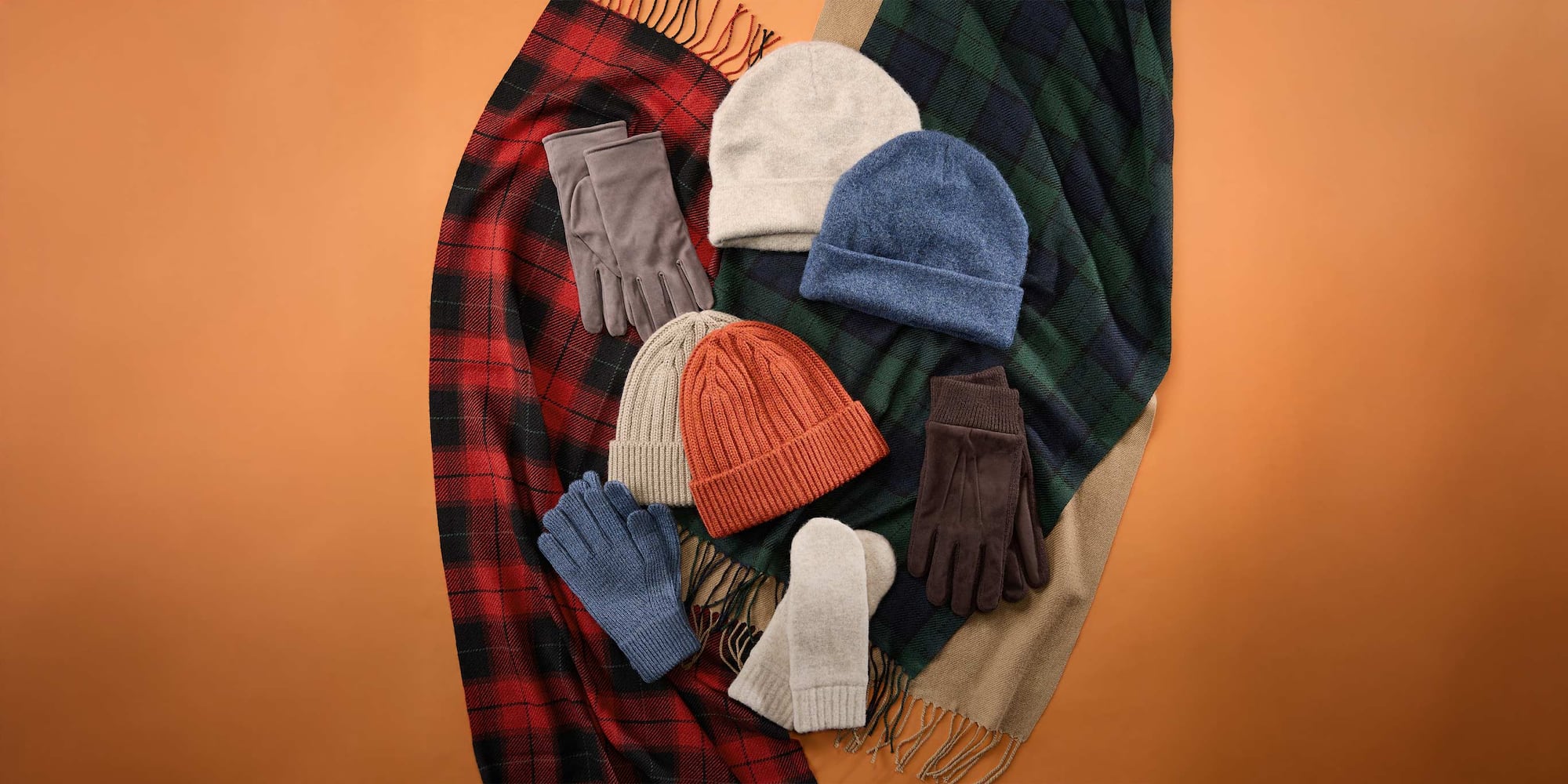 an arrangement of HEATTECH Ribbed Beanies, scarves and gloves