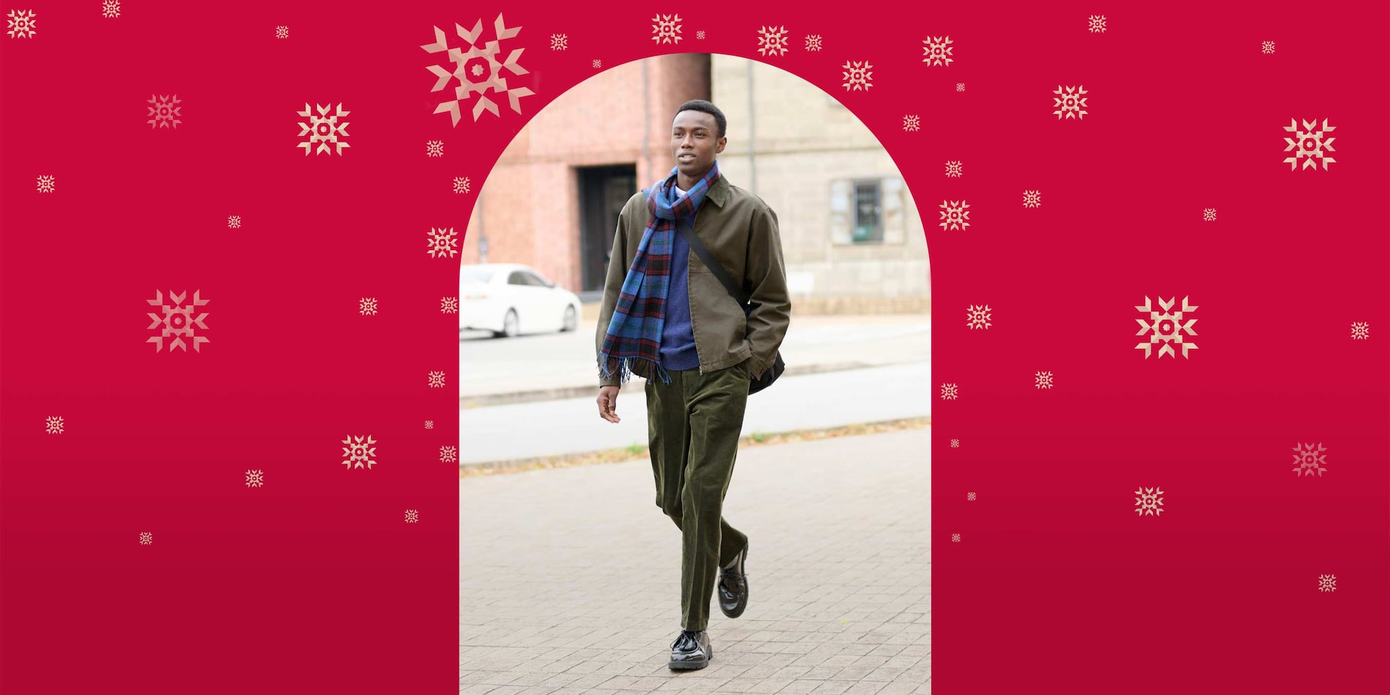 model wearing Smart Ankle Trousers in dark green with a blue knit, khaki jacket, black shoes and a blue checked scarf