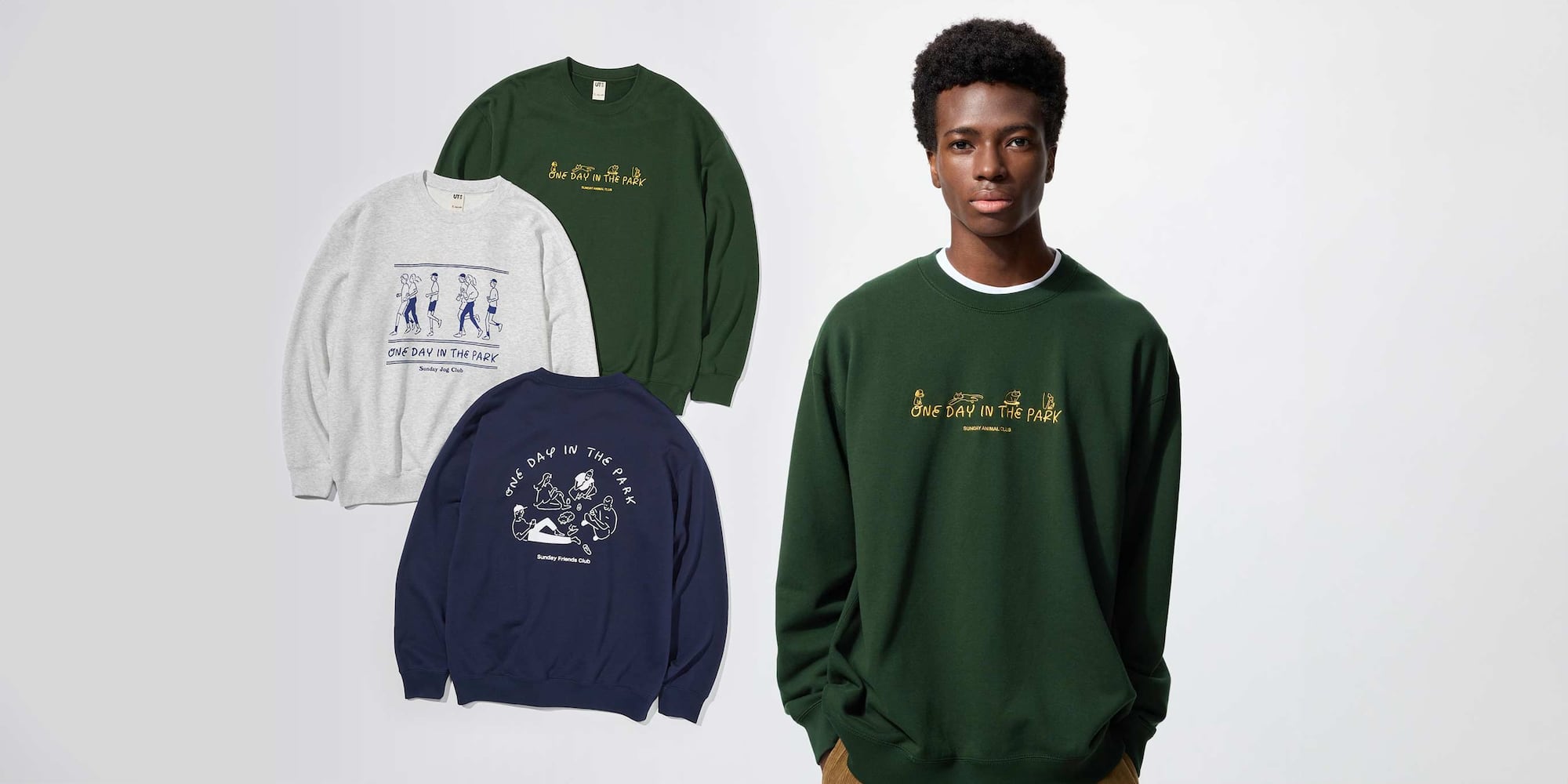 model wearing Yu Nagaba UT Graphic Sweatshirt in dark green with the words one day in the park in yellow