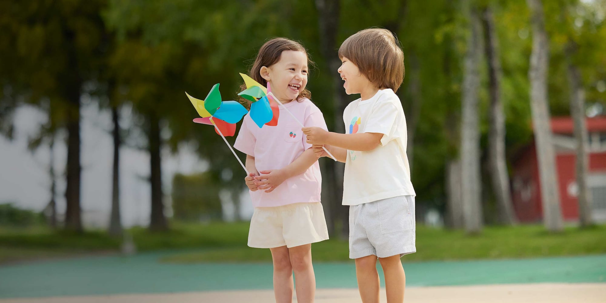 two models wearing Easy shorts in pale yellow and off white striped designs