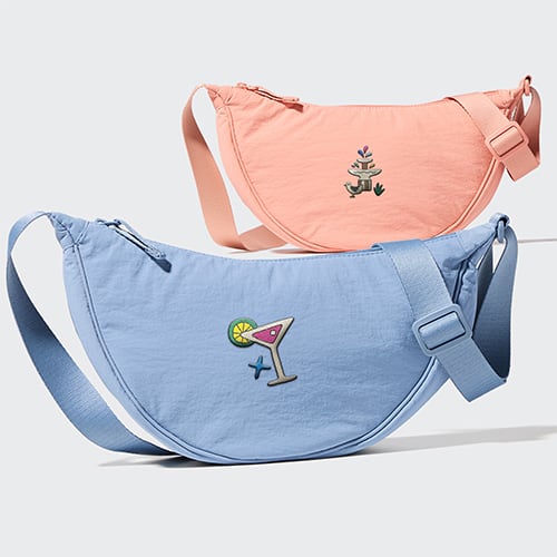 round mini shoulder bag in blue and pink with embroidery designs