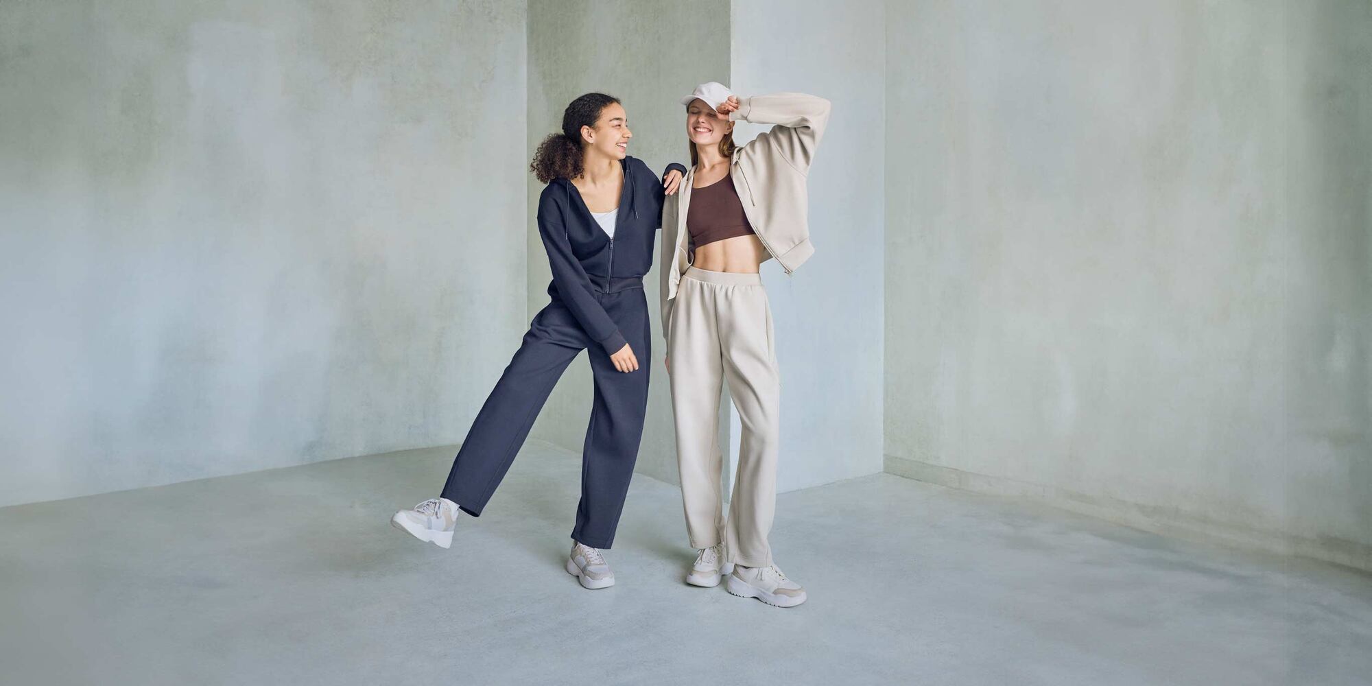 models wearing DRY Sweat Full-Zip Hoodies in natural and navy with matching joggers