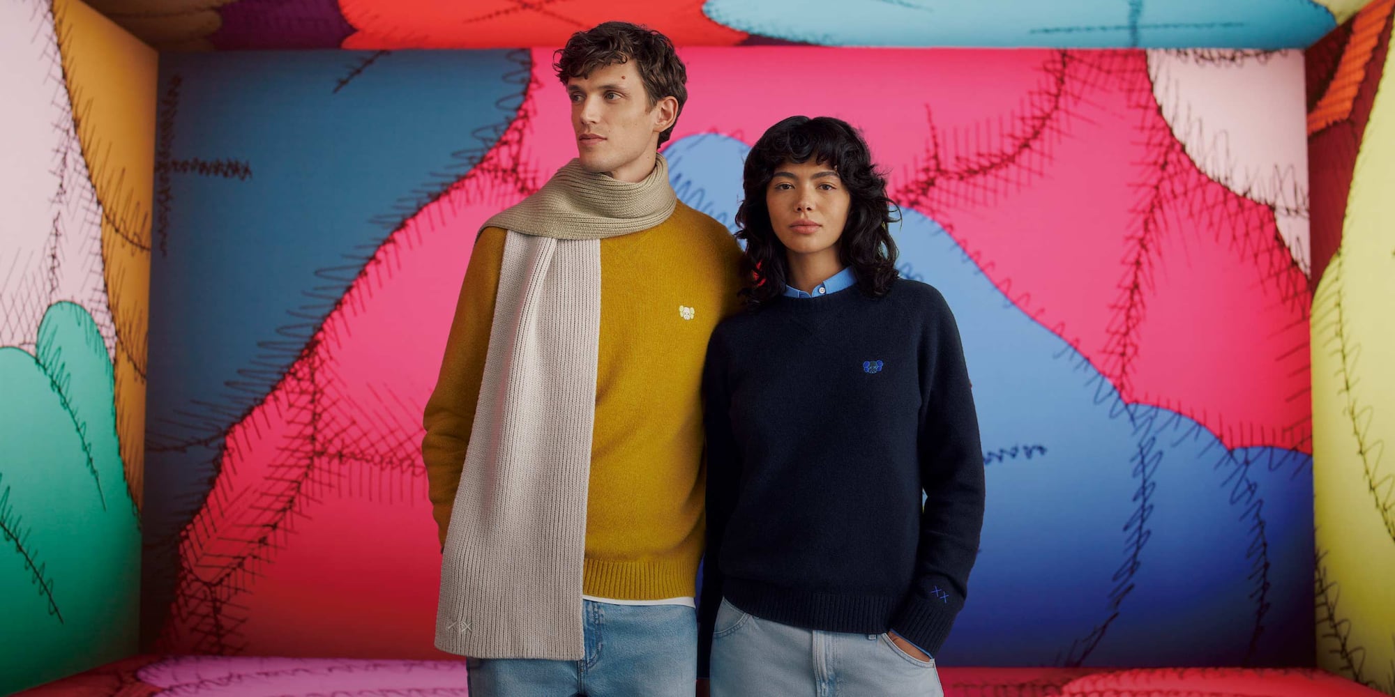 KAWS' character Companion holding several balls of yarn