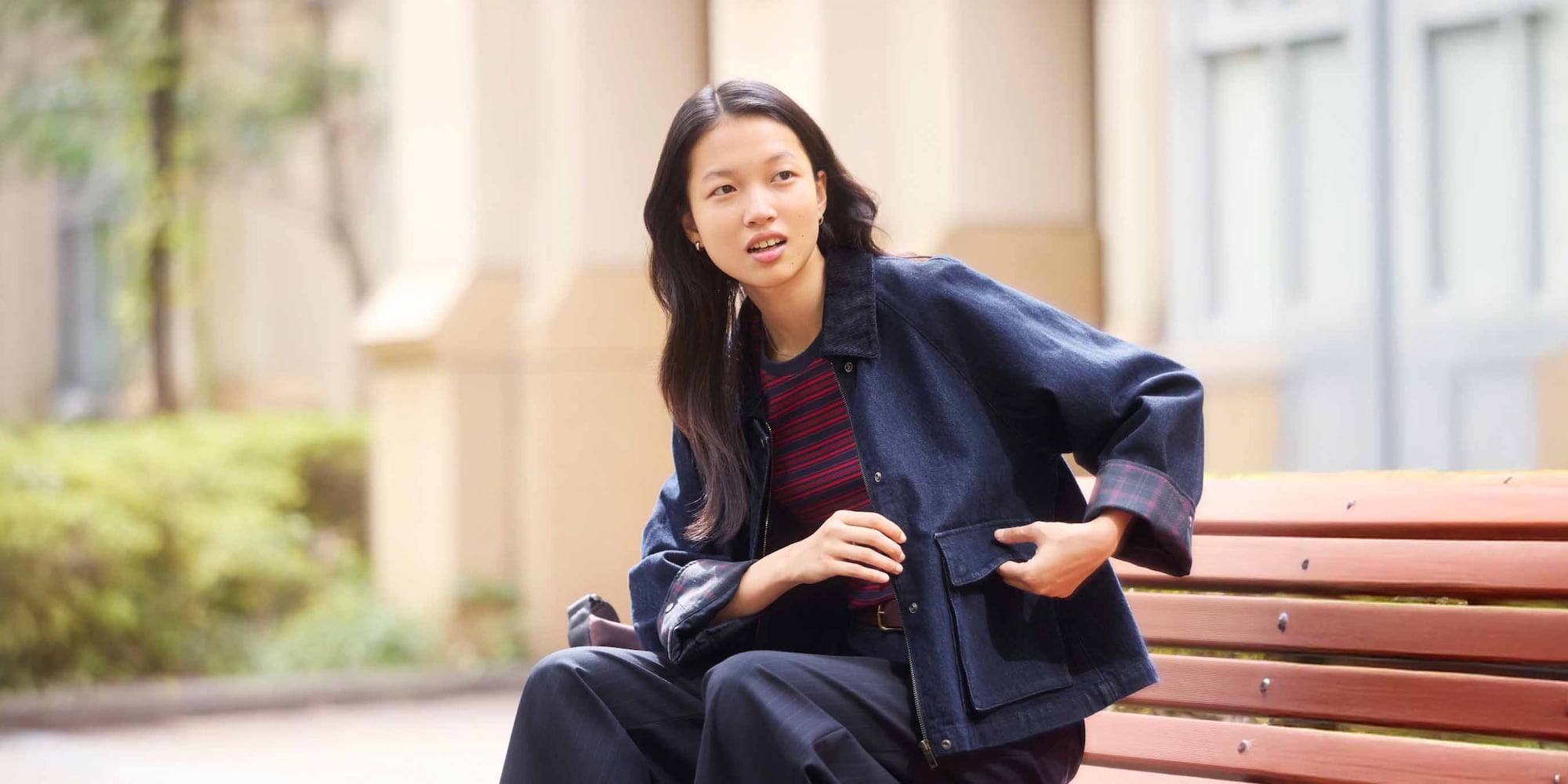 model wearing Utility Short Jacket in denim over a striped top