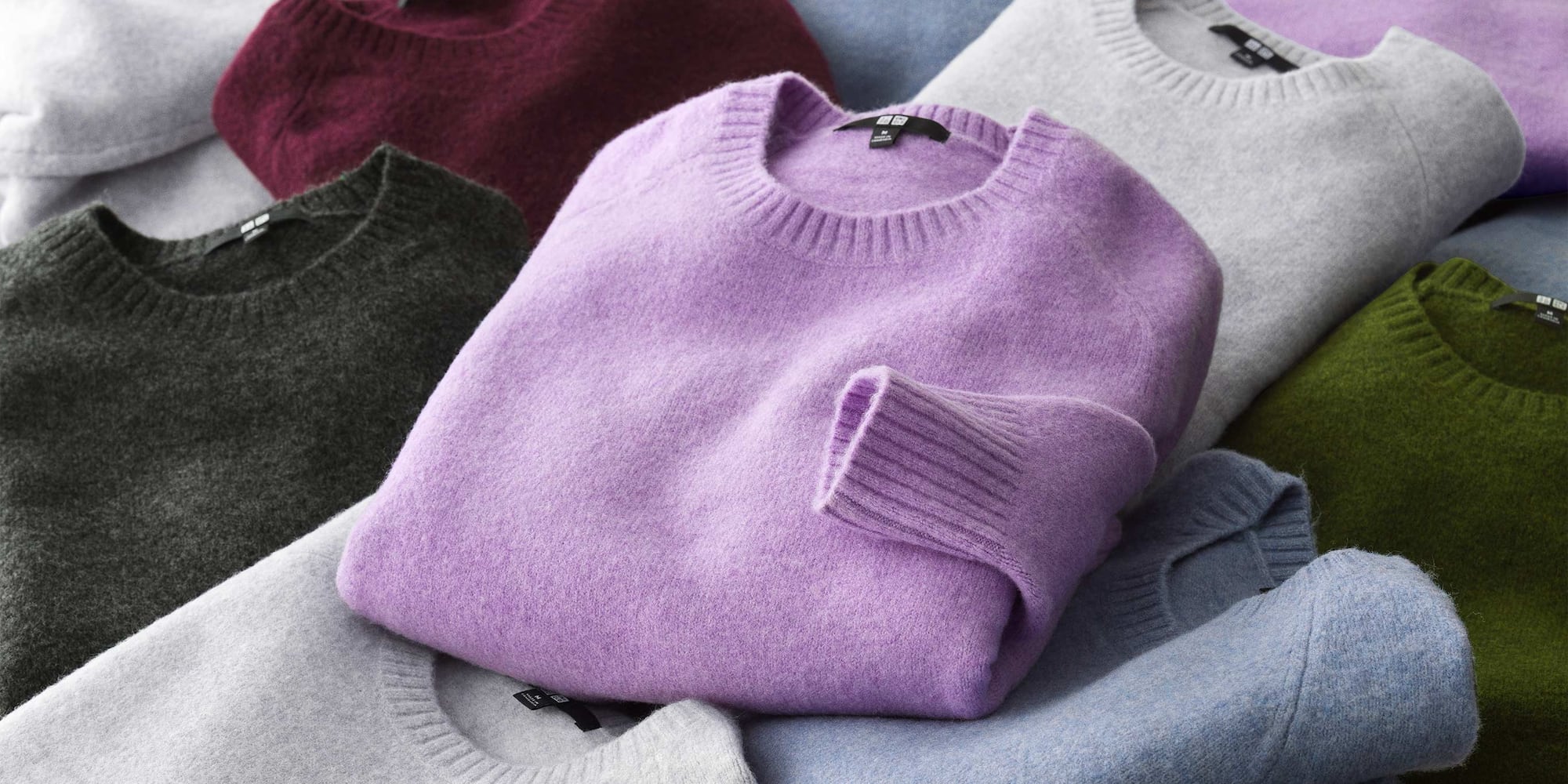 arrangement of folded Soufflé Yarn Crew Neck Jumpers in different colours
