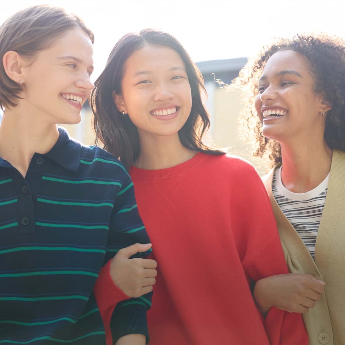 three models wearing UNIQLO spring knitwear