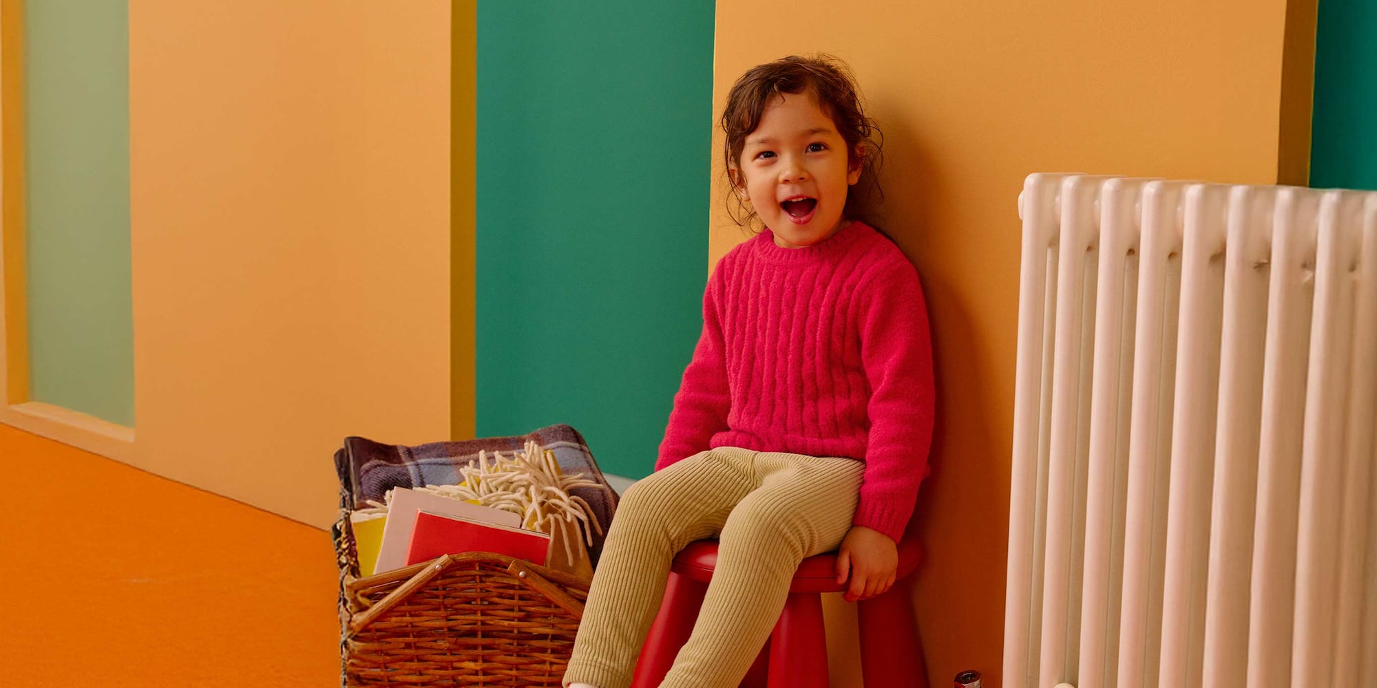 toddler wearing Soufflé Yarn Crew Neck Jumper in a pinky red colour and beige corduroy leggings