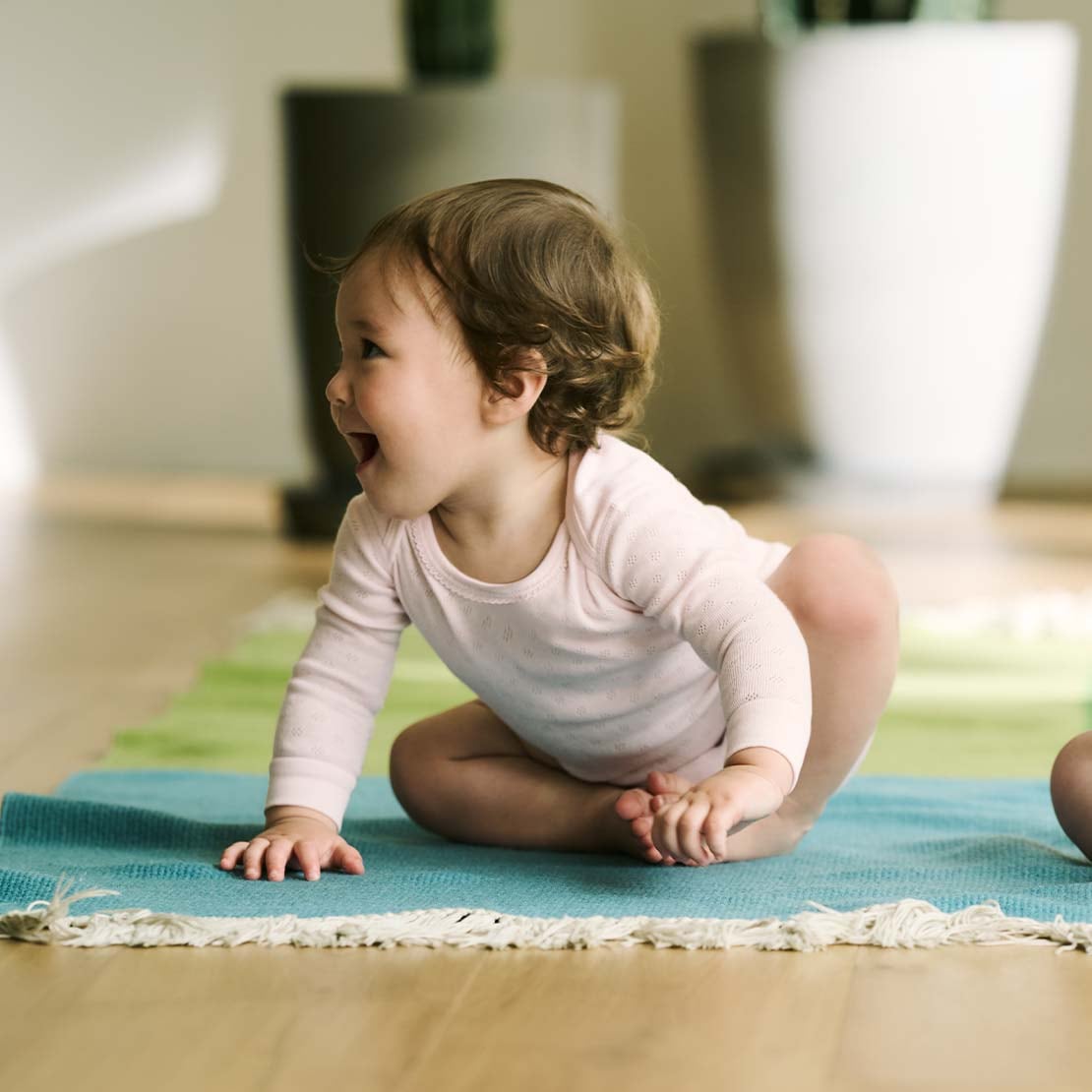 two models wearing bodysuits in pink pointelle and yellow animal print designs