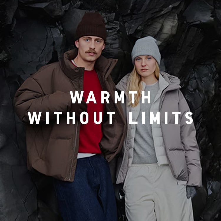 two models standing in front of black Icelandic rock