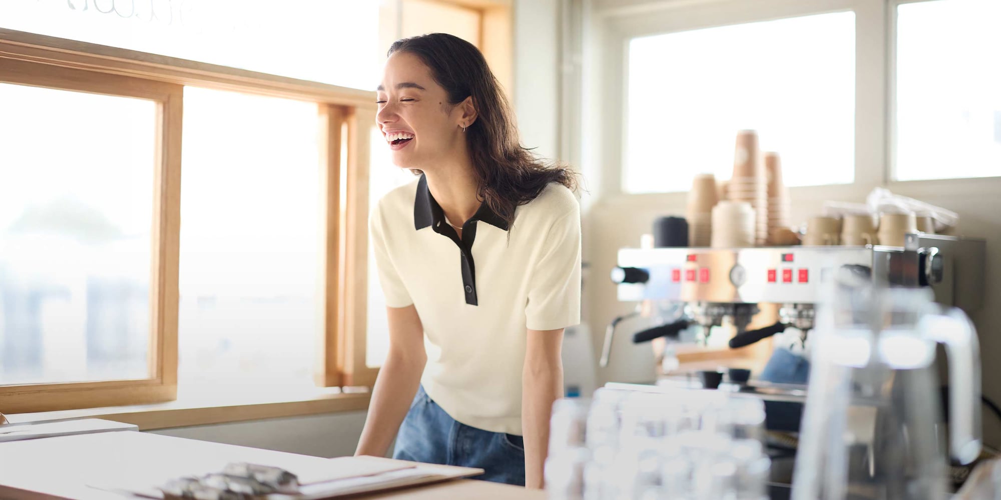 model wearing Polo Jumper in off white with jeans