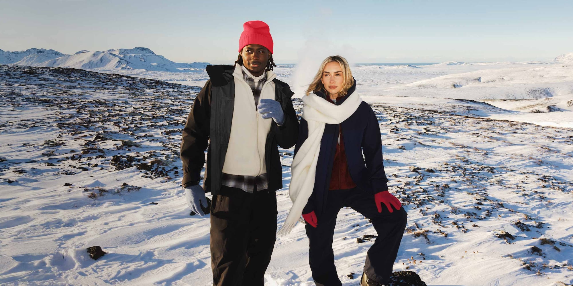 two models wearing UNIQLO x Sweden Athlete Collection skiwear