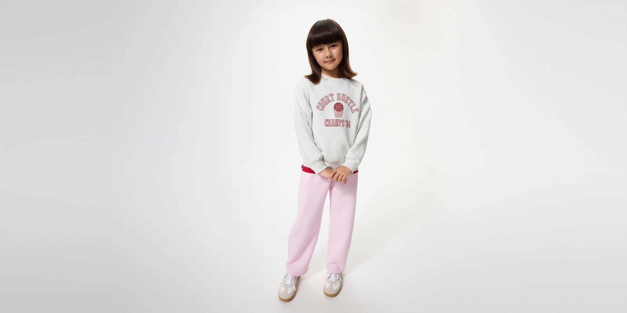 model wearing DRY Sweat Curve Trousers in pink with a grey graphic sweatshirt