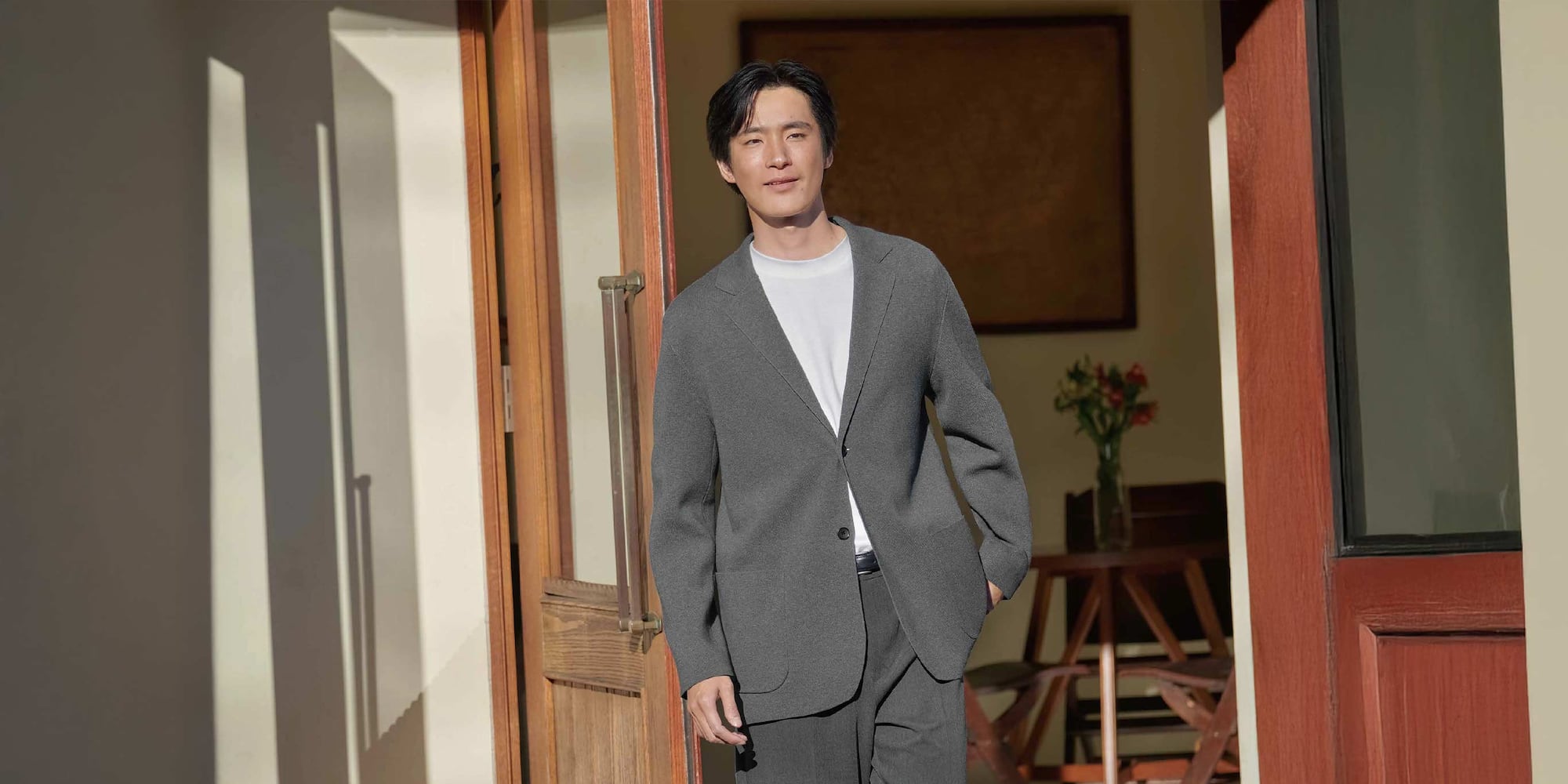 model wearing Milano Ribbed Jacket in grey over a white top with grey trousers