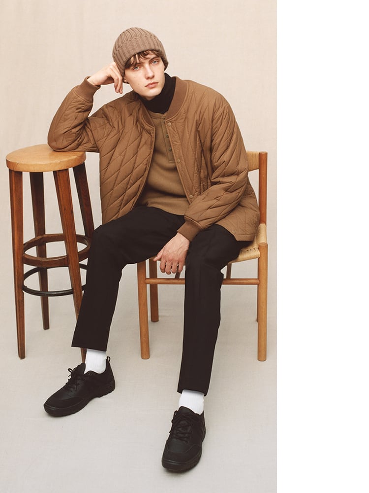 The waffle T and outerwear are in brown, while the turtleneck and pants are in black for an elegant two-tone look.