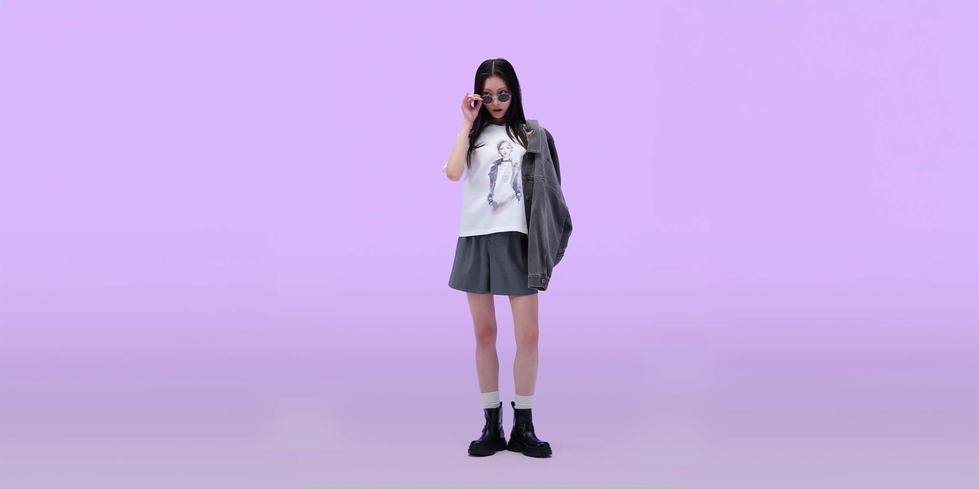 model wearing Ai Yazawa UT Graphic T-Shirt with a skirt, denim jacket and sunglasses