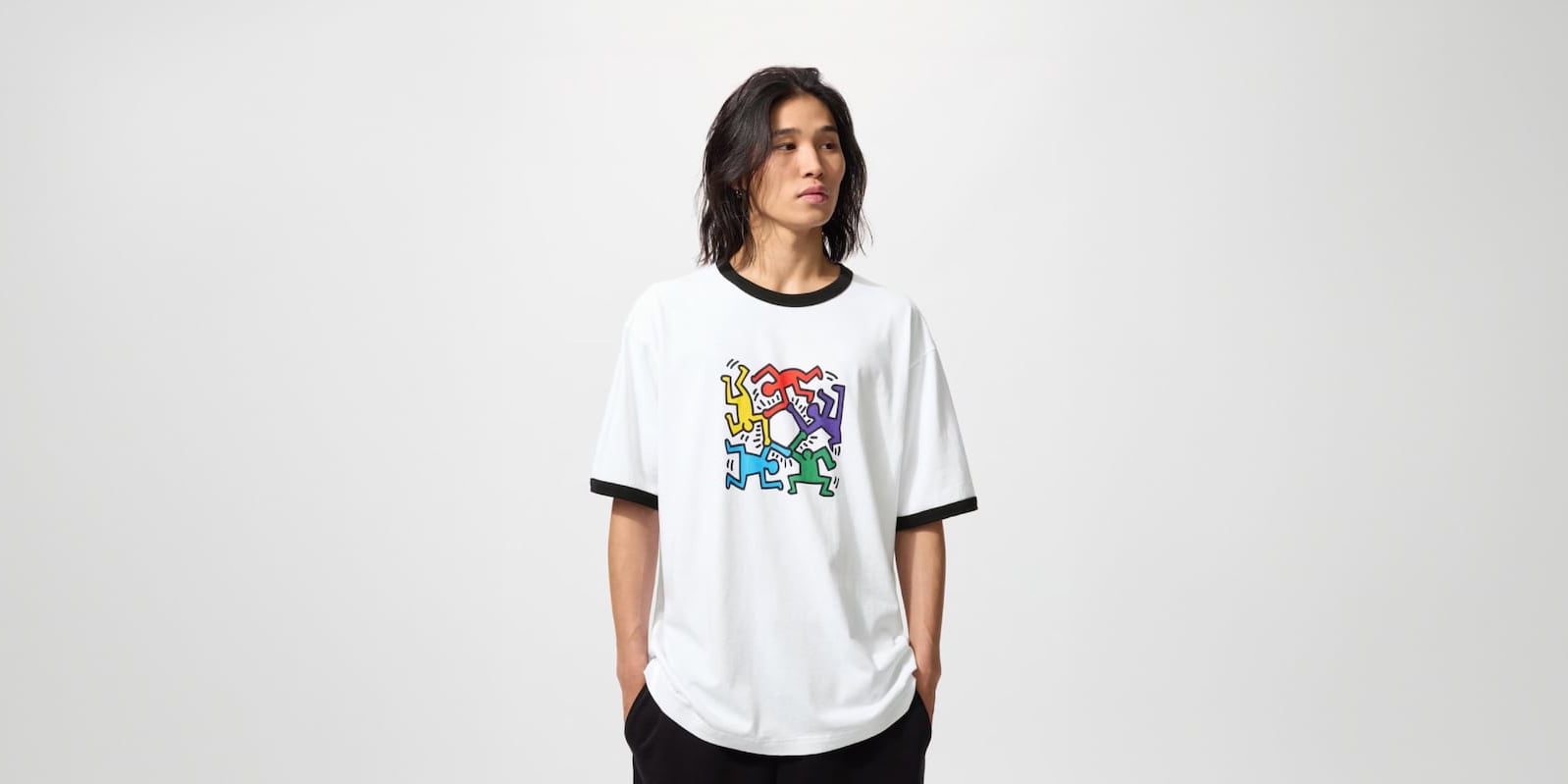 model wearing NY POP ART UT Graphic T-Shirt featuring artwork by Keith Haring