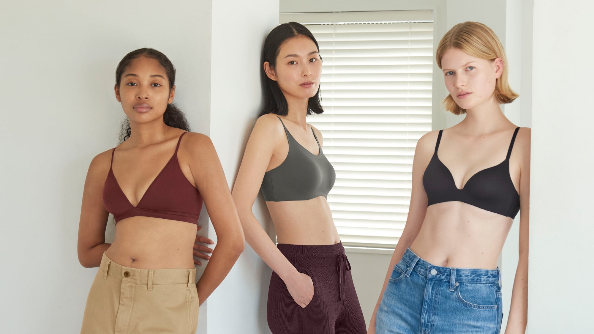 three models, each wearing a different style of wireless bra