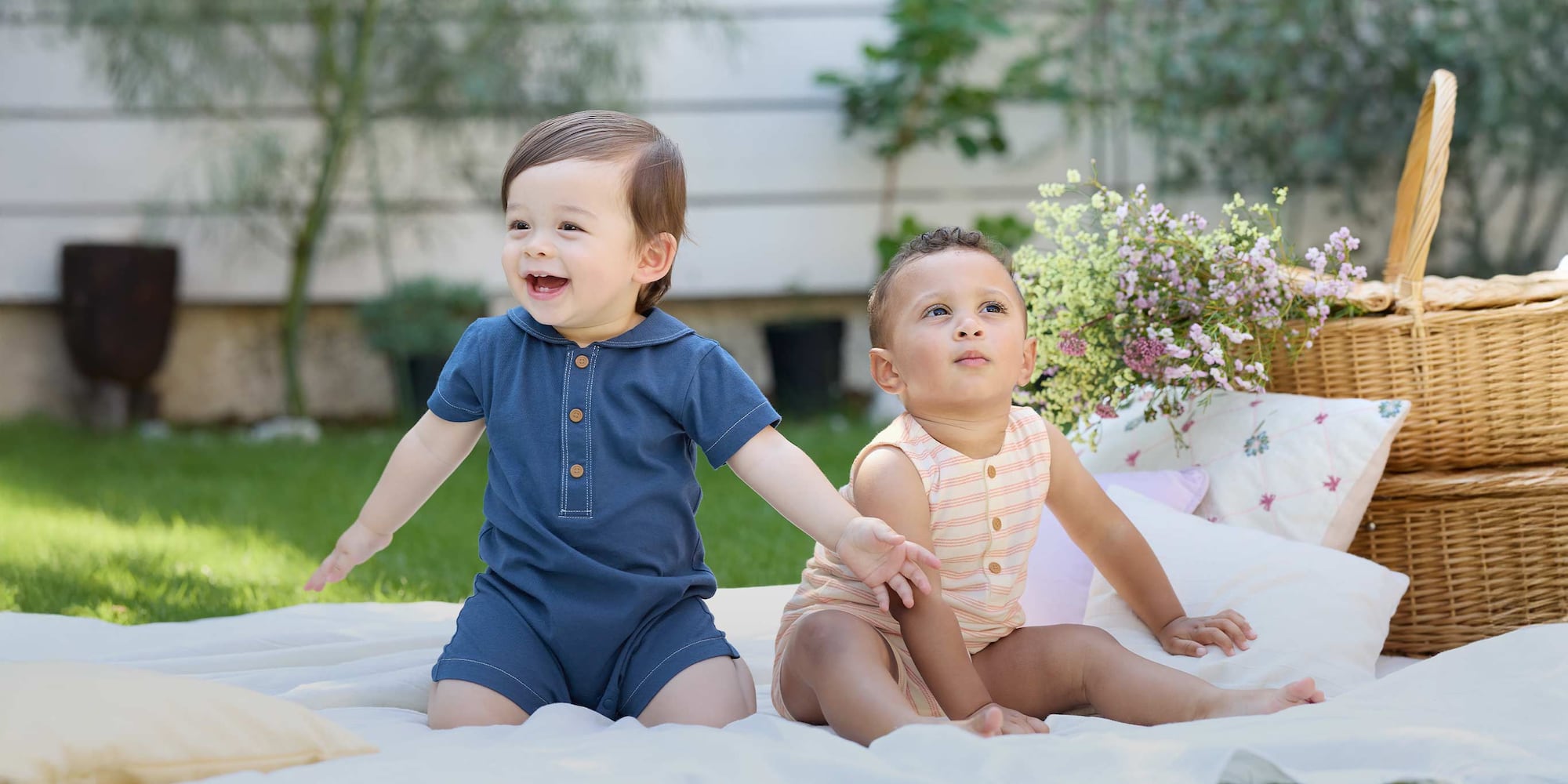two models wearing bodysuits in pink pointelle and yellow animal print designs