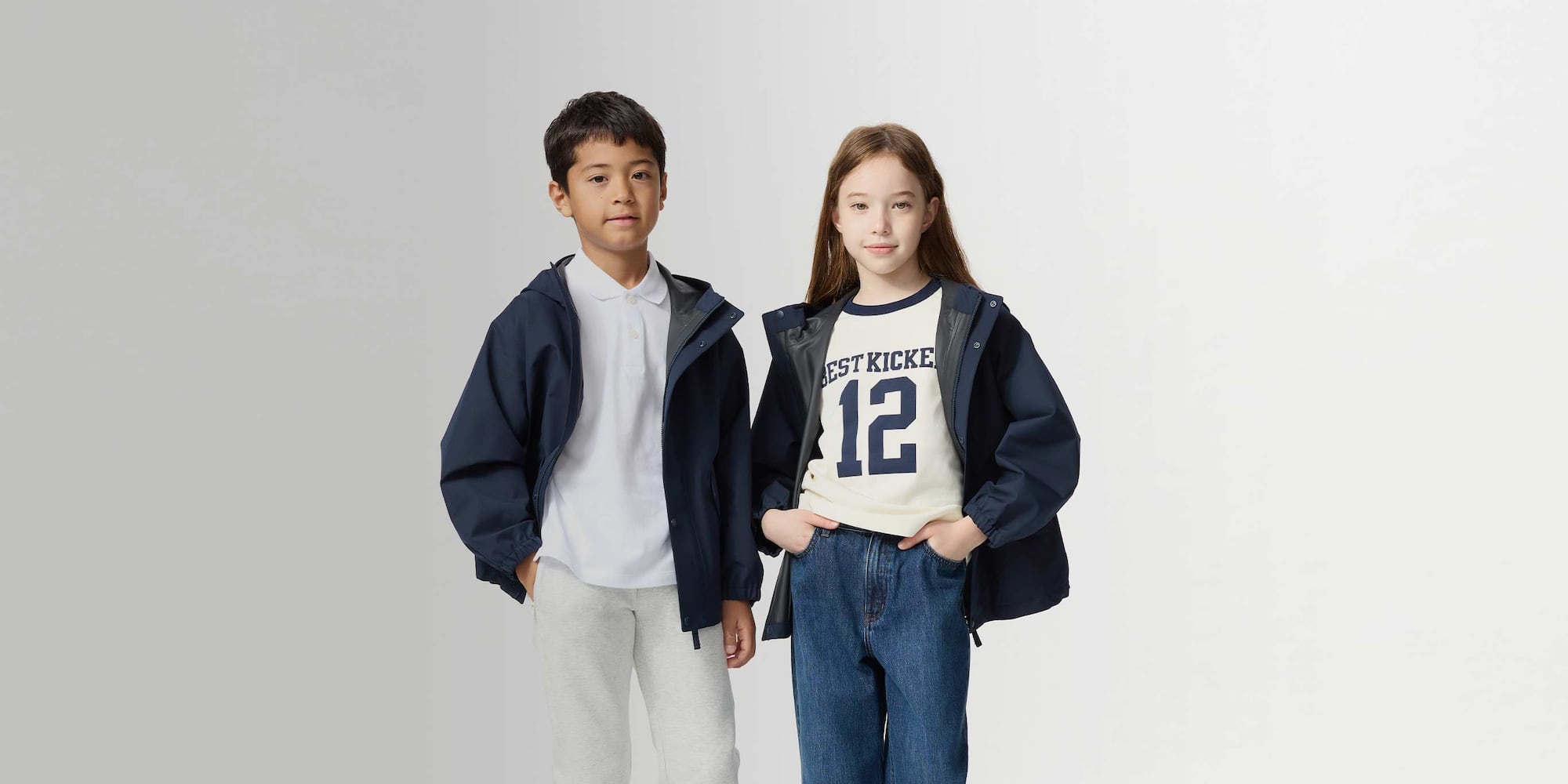 two models wearing UNIQLO BLOCKTECH Parkas in navy