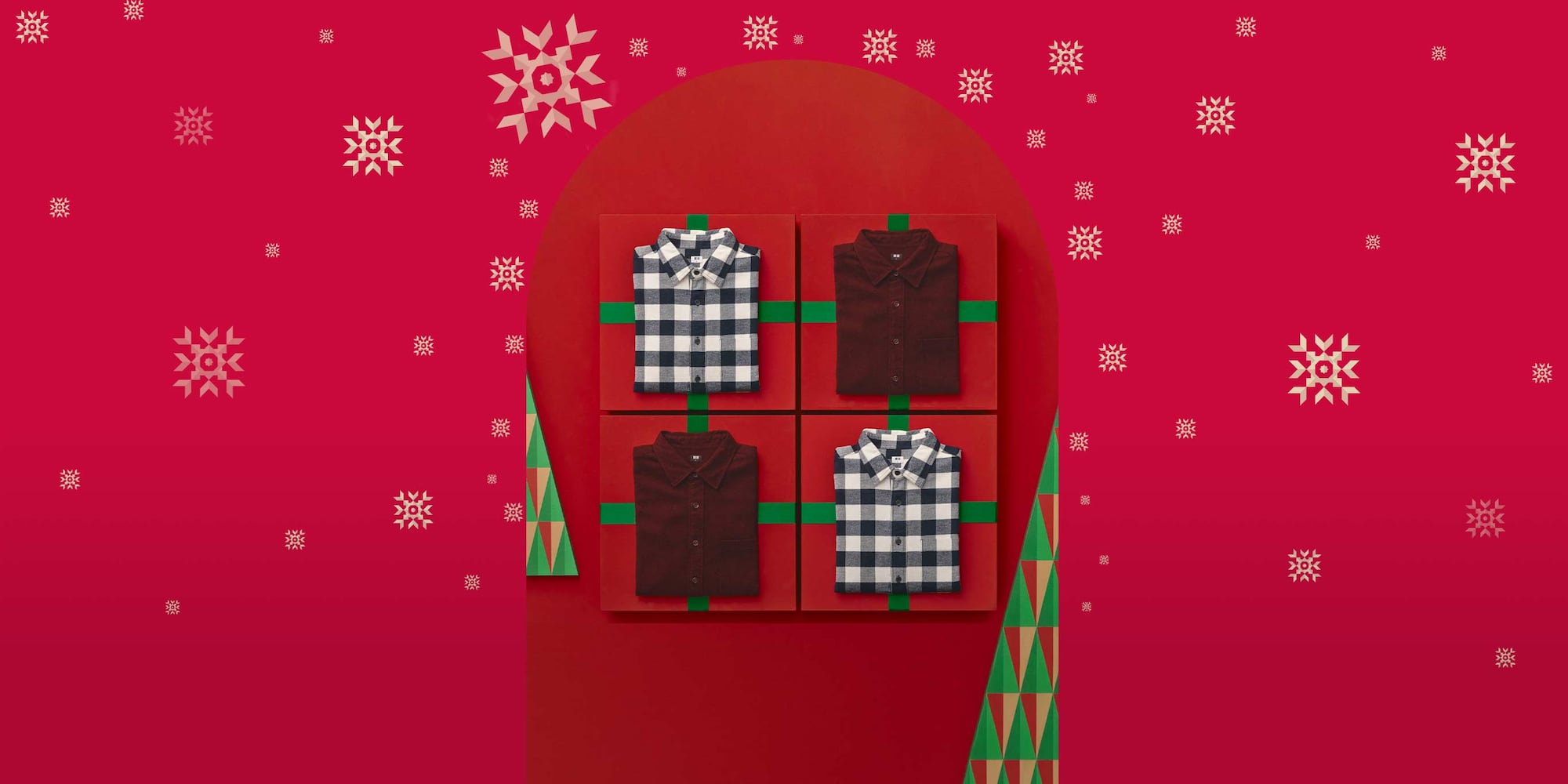 vier Flanellhemden, die auf Geschenkboxen gefaltet sind