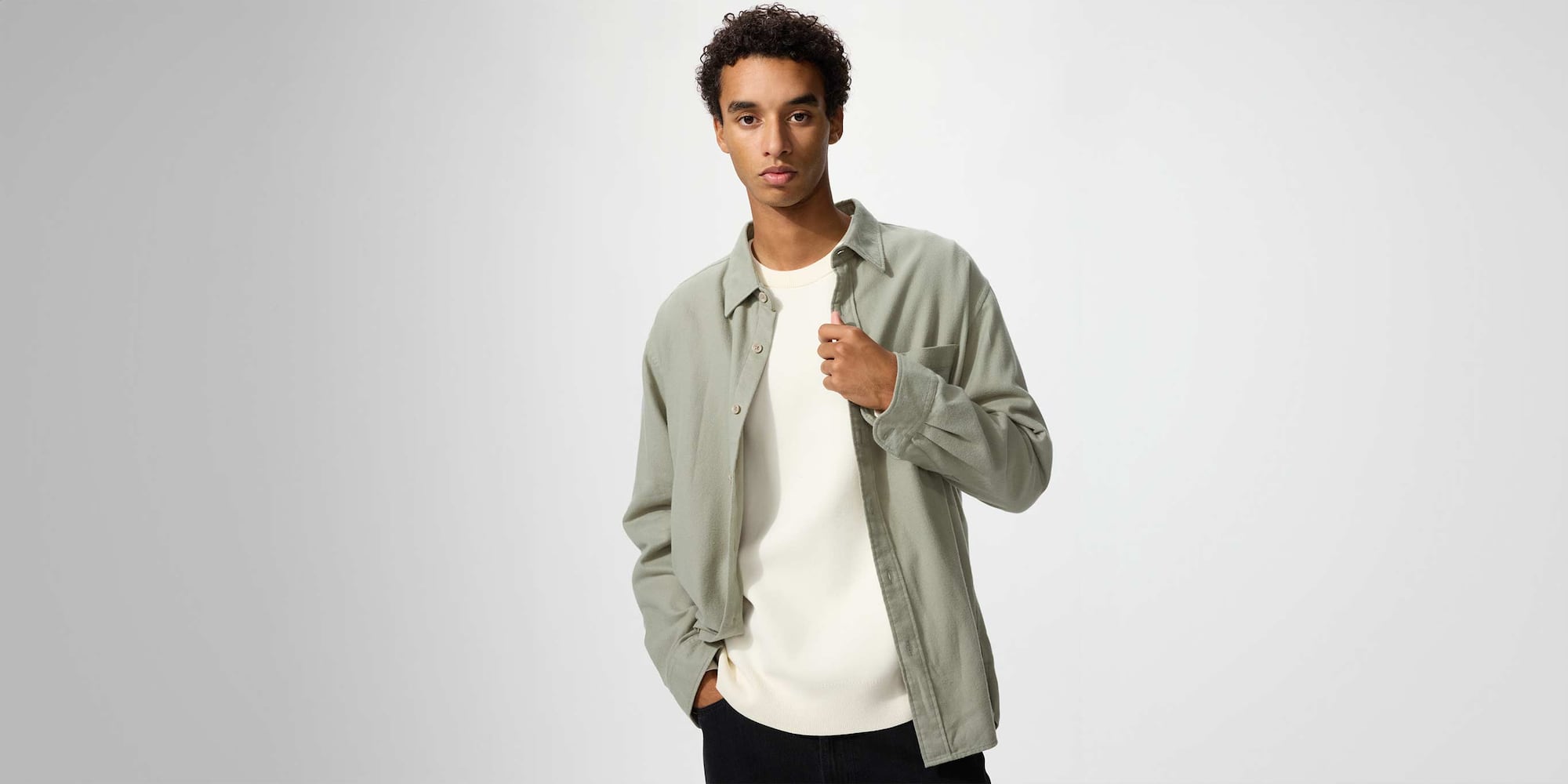 model wearing Flannel Shirt in an off white check over a grey T-shirt