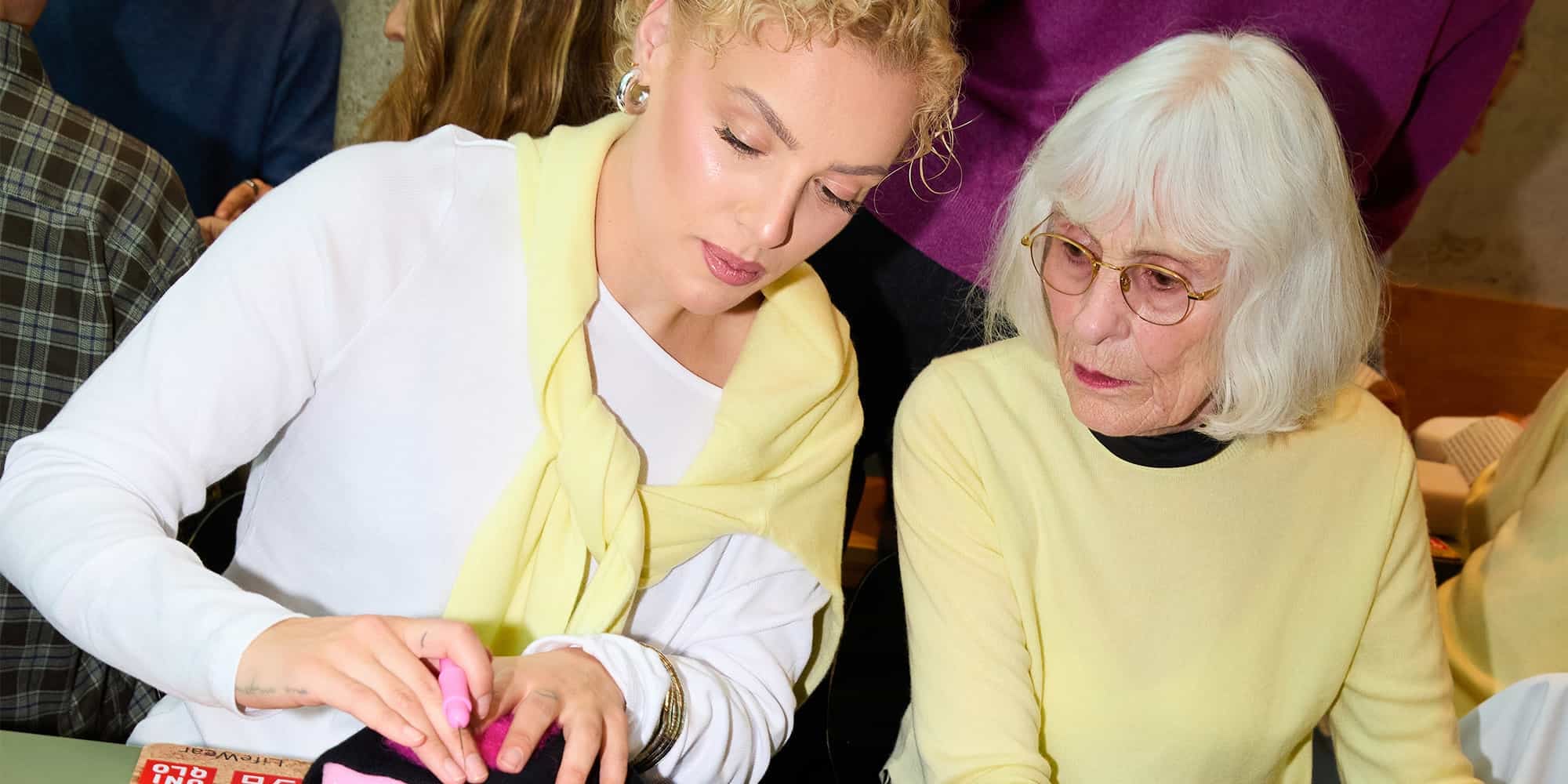 Two women wearing yellow cashmere