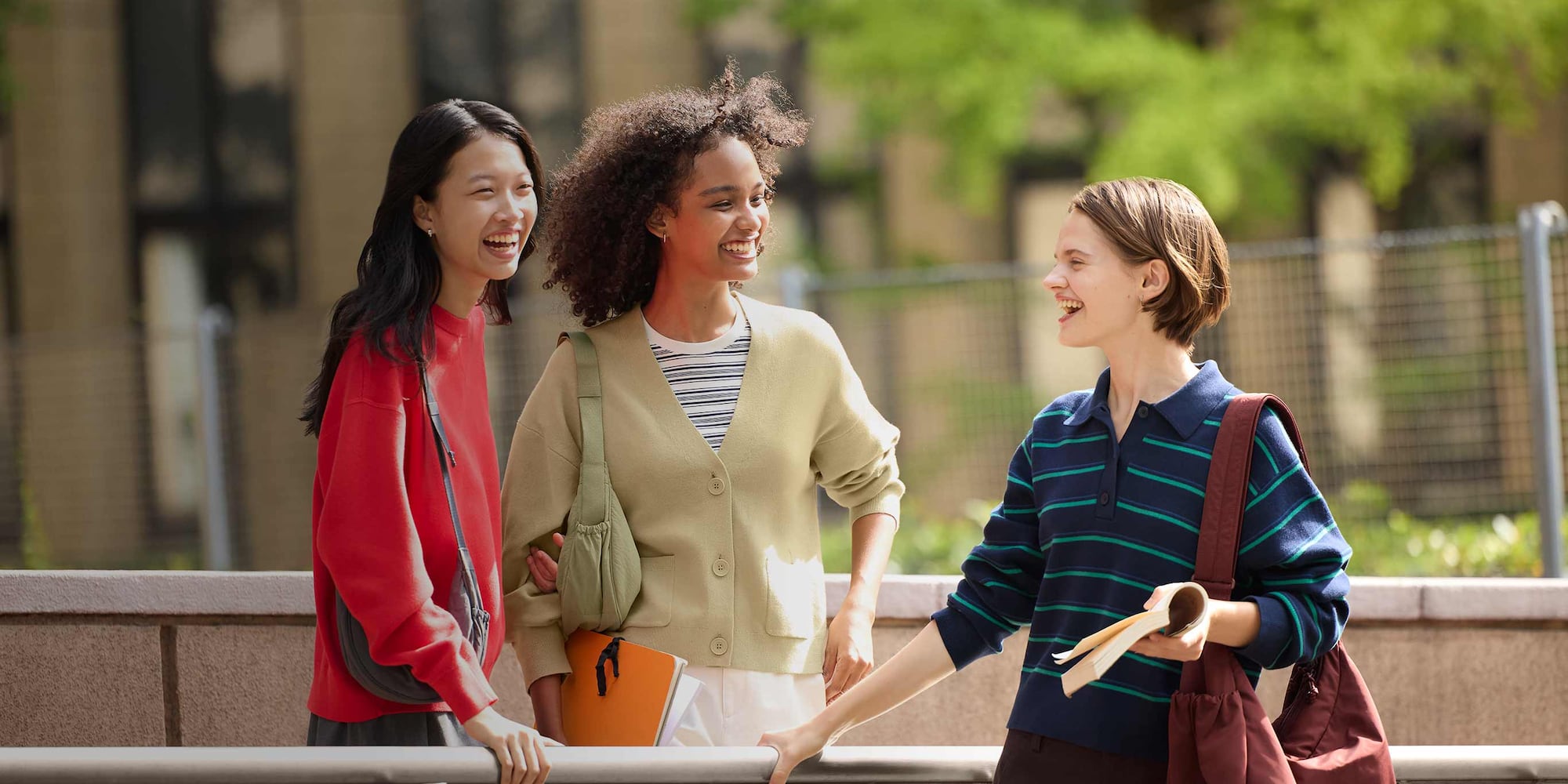 three models wearing UNIQLO knitwear