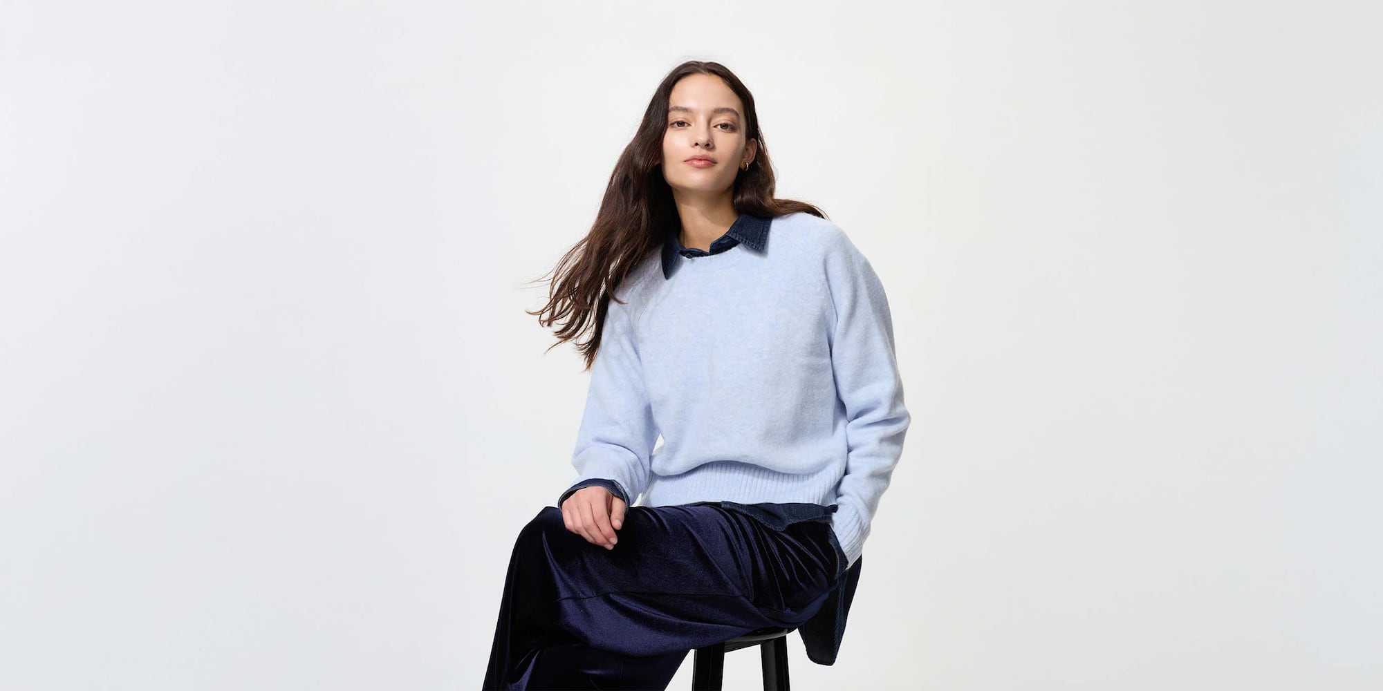 model wearing Soufflé Yarn Crew Neck Jumper in light blue over a denim shirt