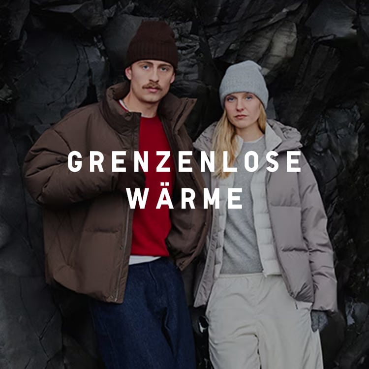 two models standing in front of black Icelandic rock