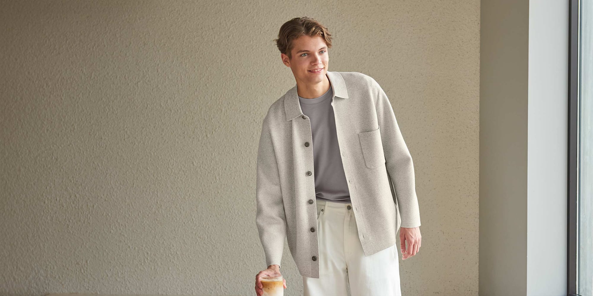 model wearing Milano Ribbed Shirt Collar Cardigan in olive over a grey T-shirt and trousers