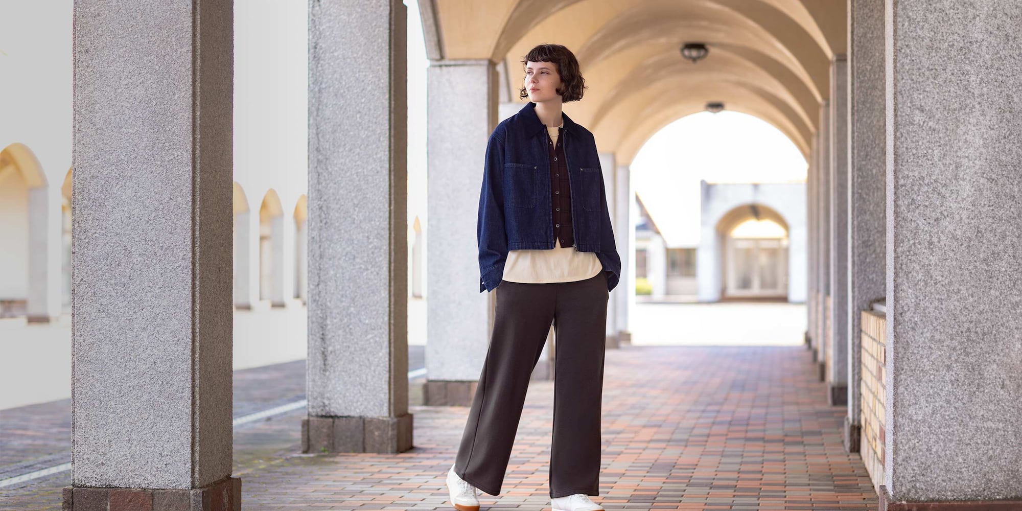 model wearing Warm Fleece Straight Trousers in dark brown with a denim jacket, cardigan and T-shirt
