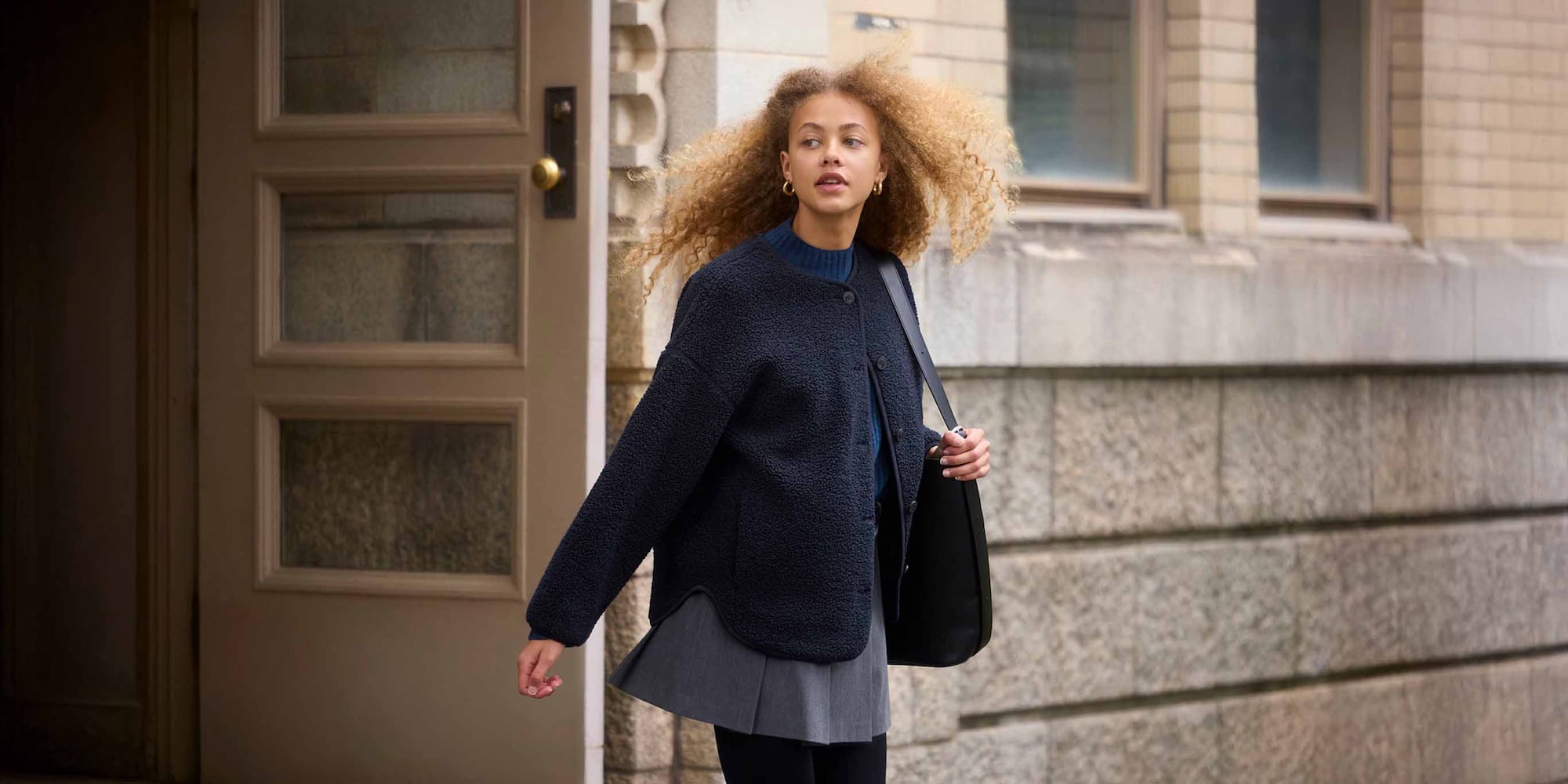 Collarless design can be worn as a middle or outer layer.