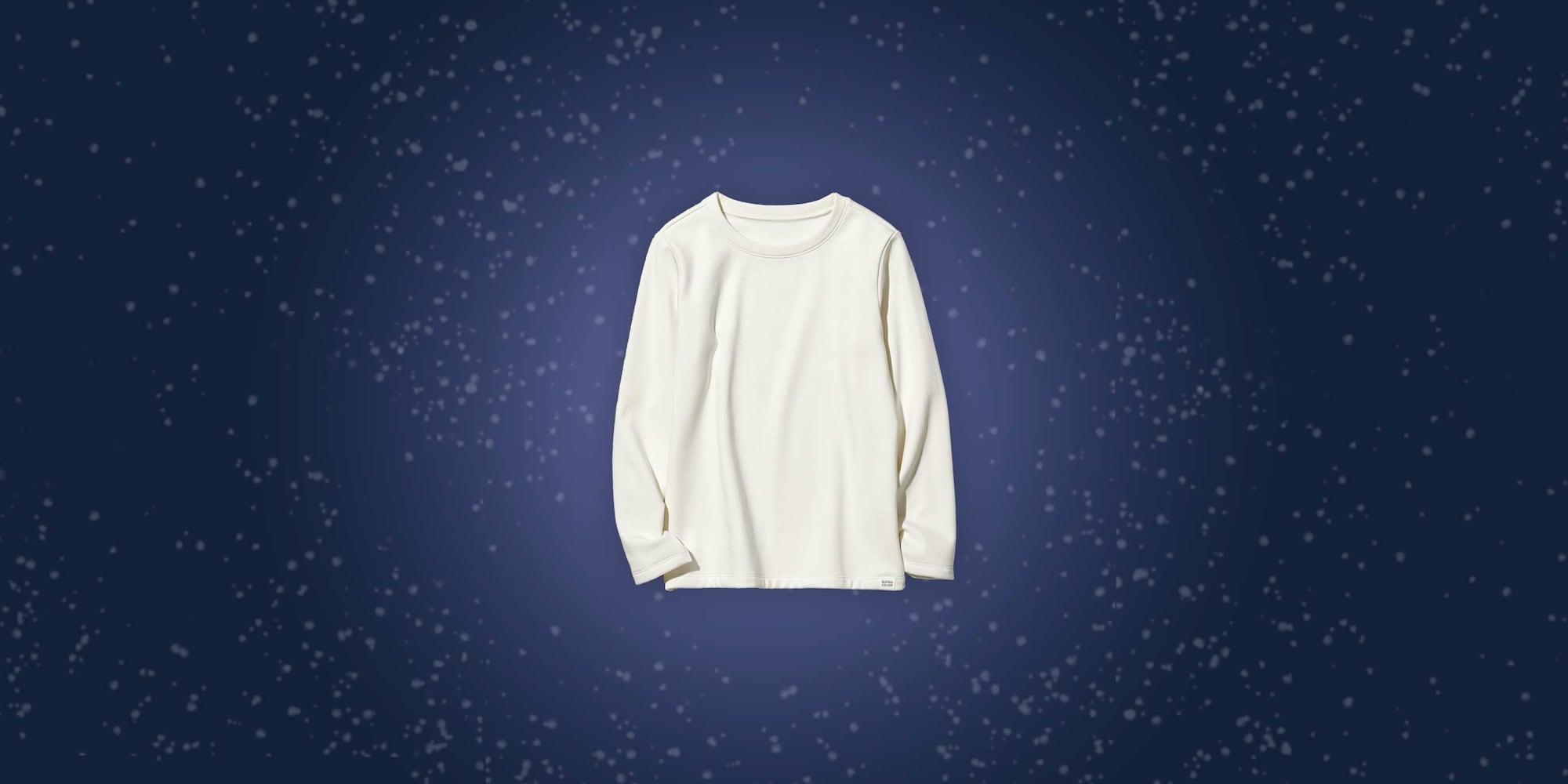 white HEATTECH Ultra Warm T-shirt for kids against a blue background