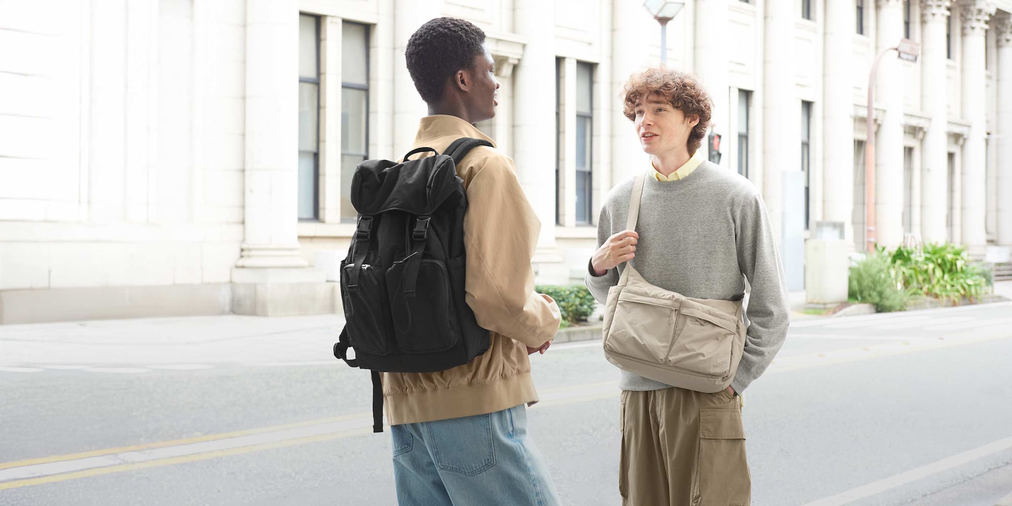 two models carrying UNIQLO bags