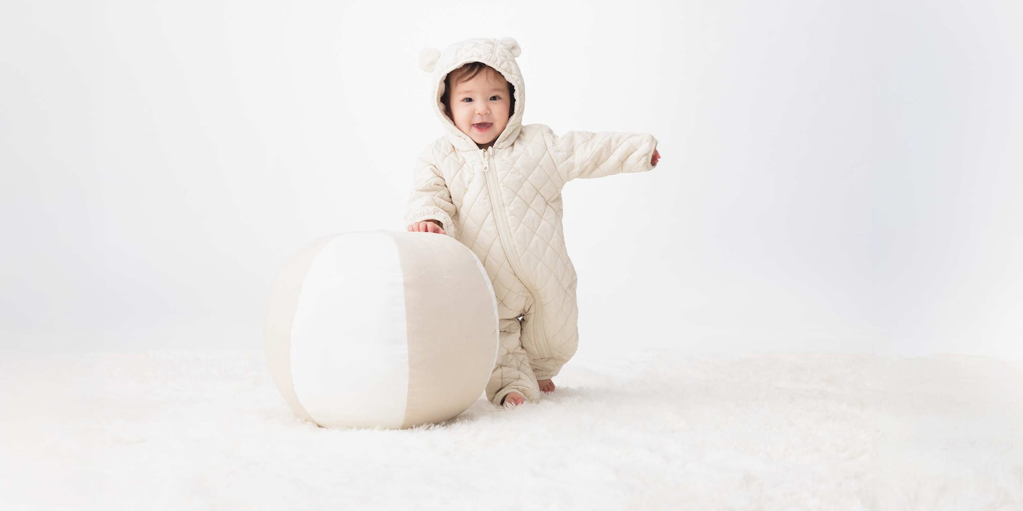 PUFFERTECH Washable One Piece Outfit in off white,  showing the fleece lining and folded cuffs