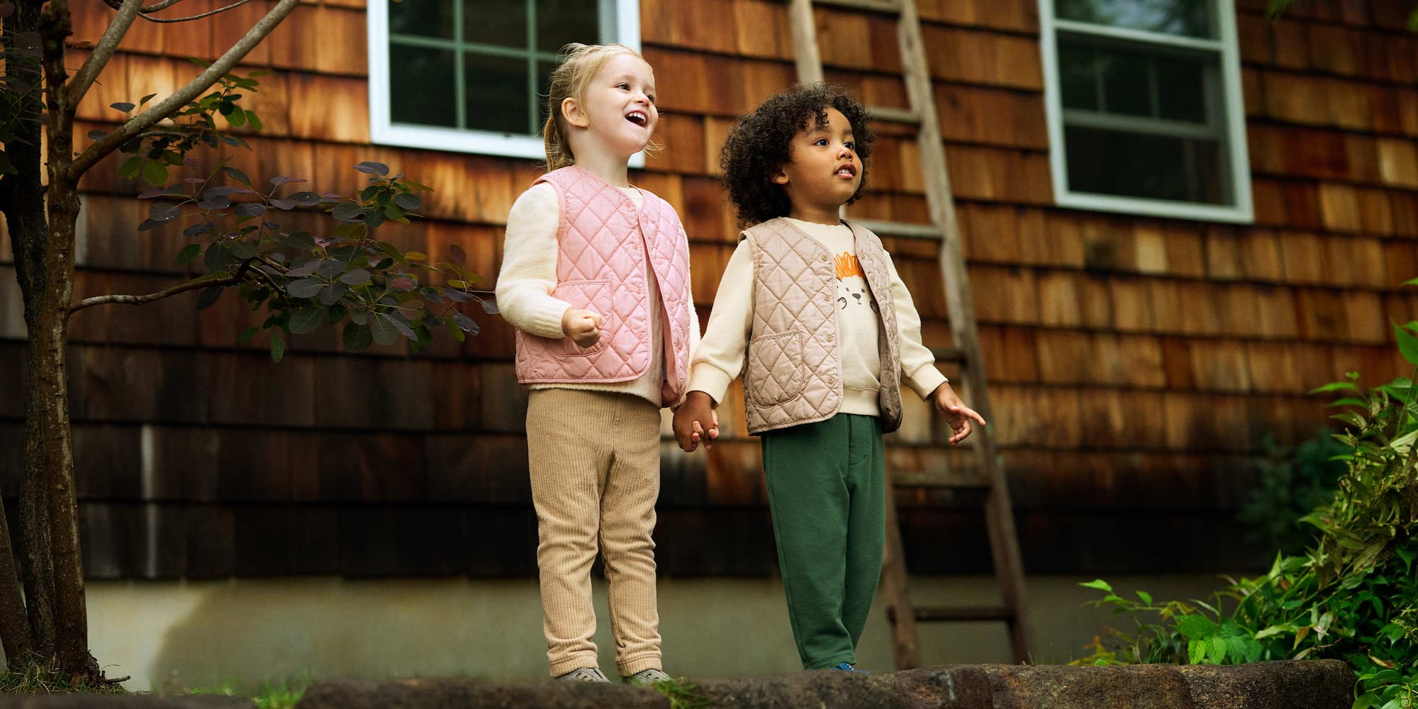 two models wearing PUFFERTECH Washable Vest in pink and beige