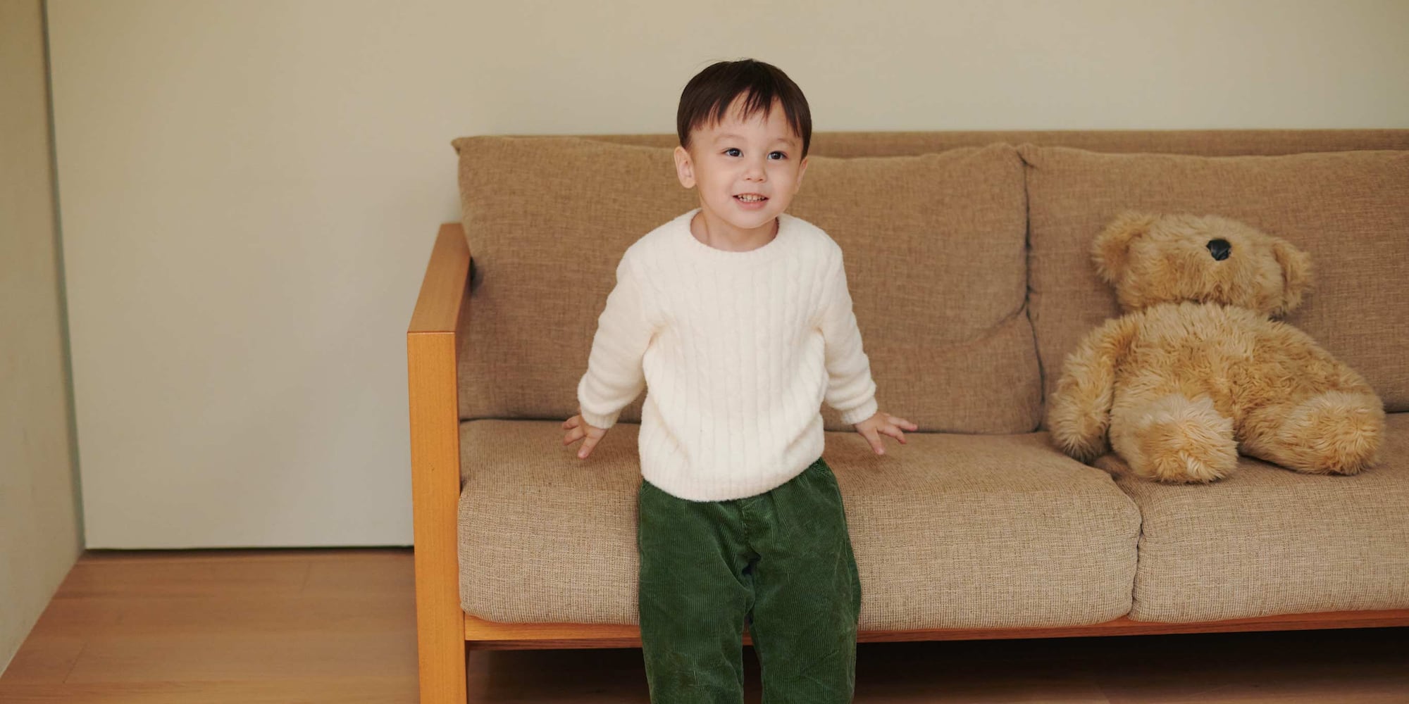 toddler wearing Soufflé Yarn Crew Neck Jumper in a pinky red colour and beige corduroy leggings