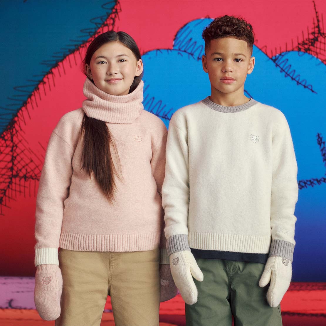 two models wearing KAWS WINTER Soufflé Yarn Jumpers in pink and off white