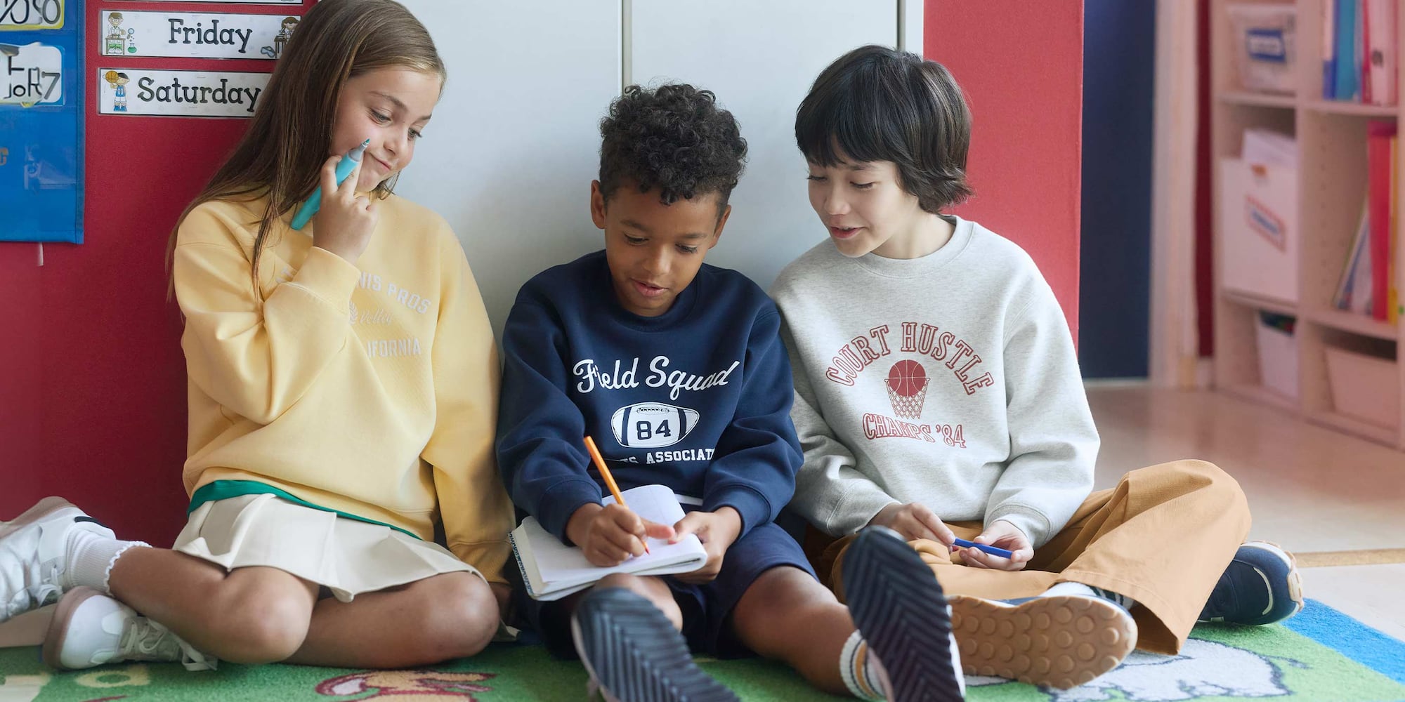 models wearing graphic print sweatshirts