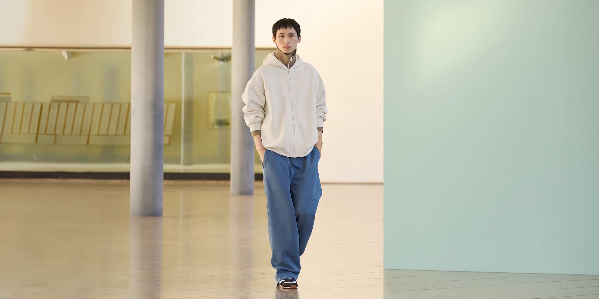 model wearing Oversized Sweat Full-Zip Hoodie in natural over a brown funnel neck zip-through top with joggers