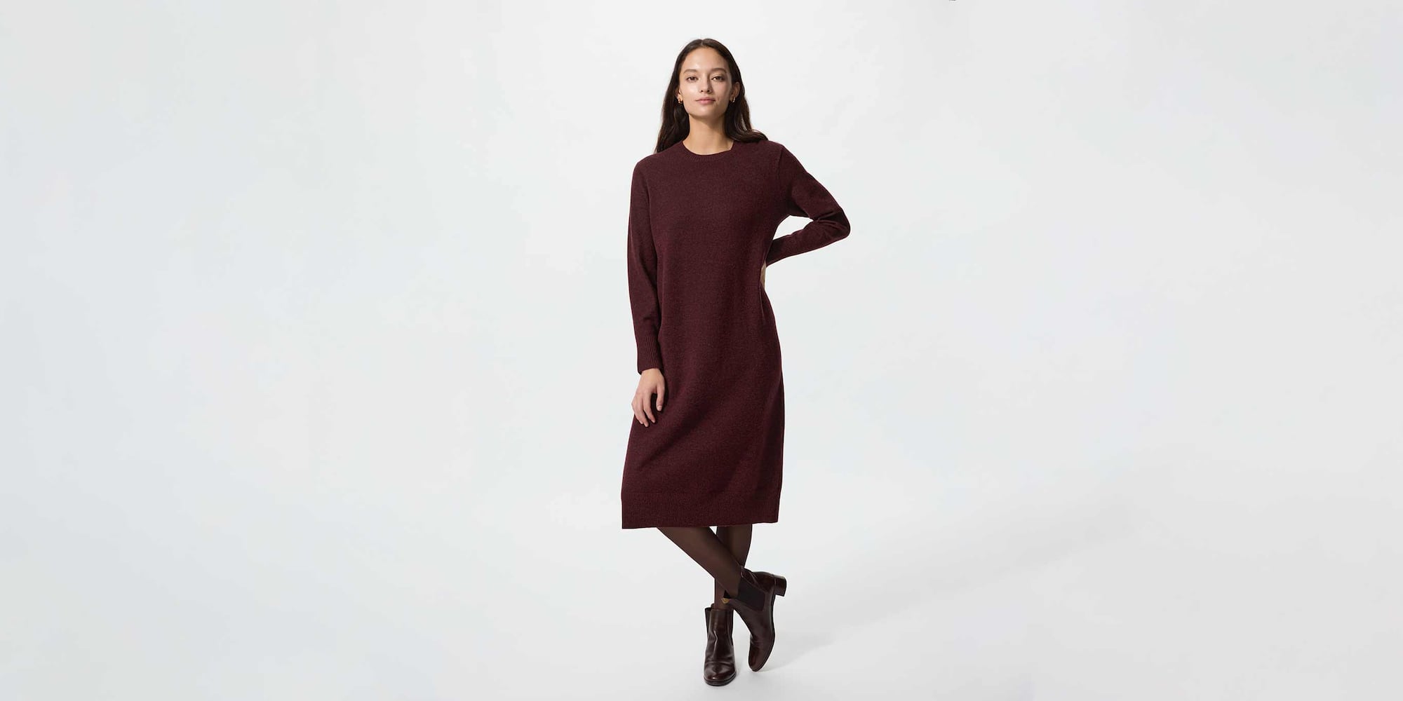 model wearing Soufflé Yarn Dress in wine over a red turtleneck with dark grey jeans