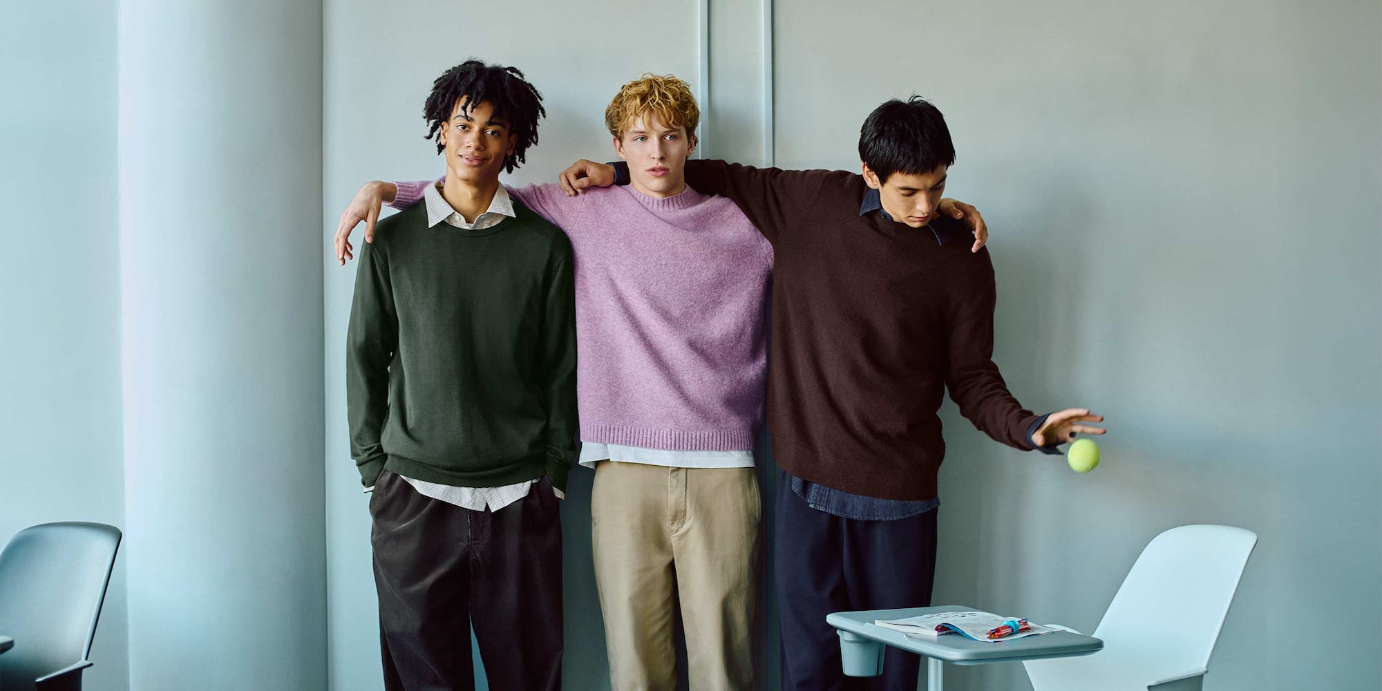 three models wearing UNIQLO knitwear, with the central model wearing a pink Soufflé Yarn Crew Neck Jumper