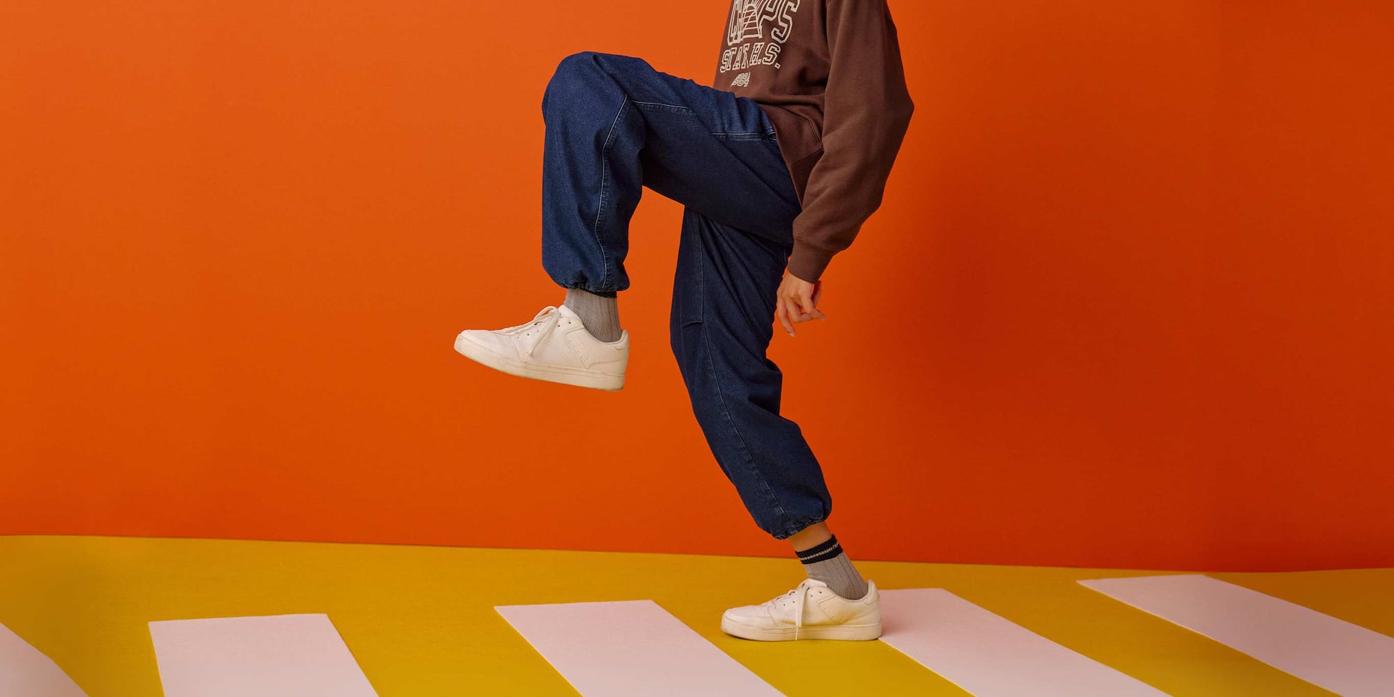 close-up of a pair of legs wearing grey HEATTECH Socks