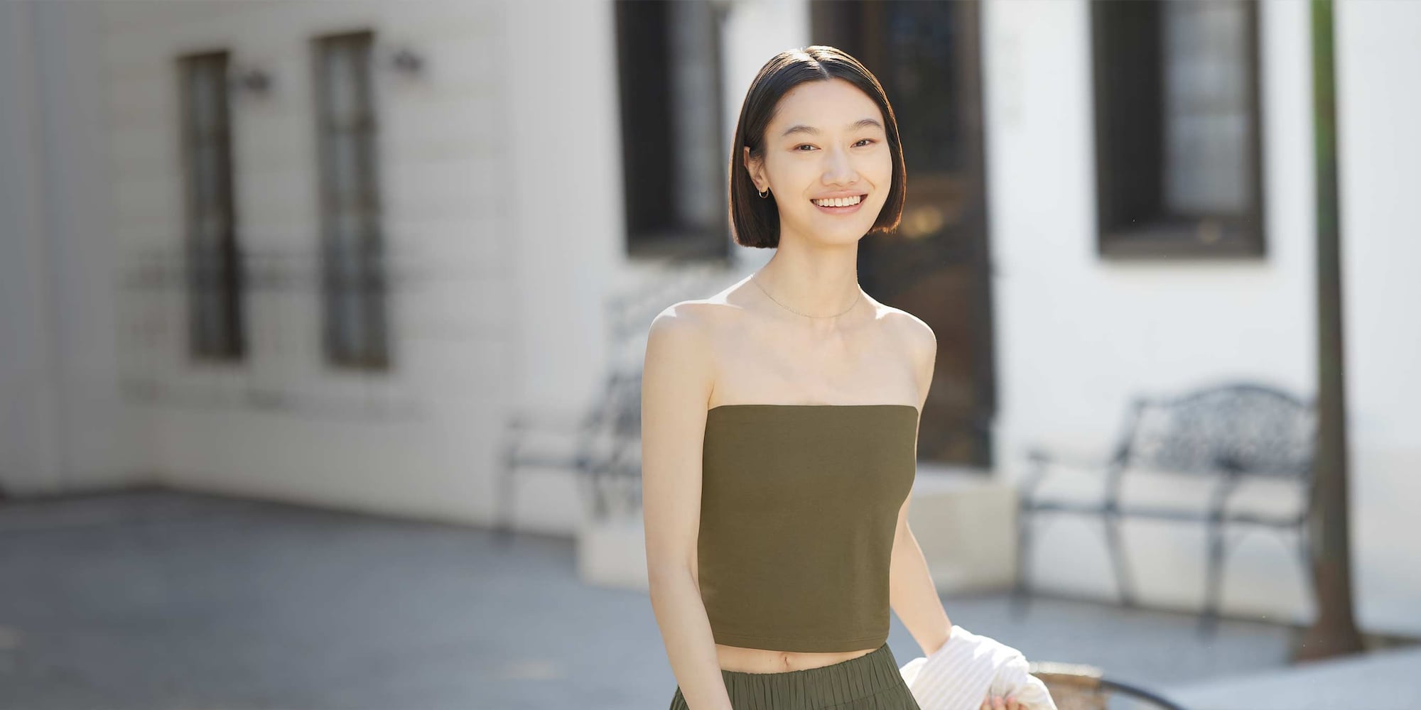 model wearing strapless top in olive